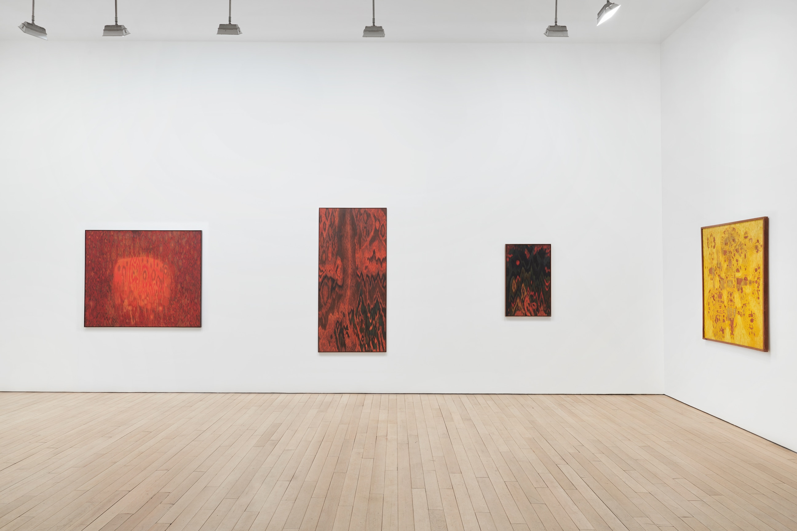 Installation view of four artworks