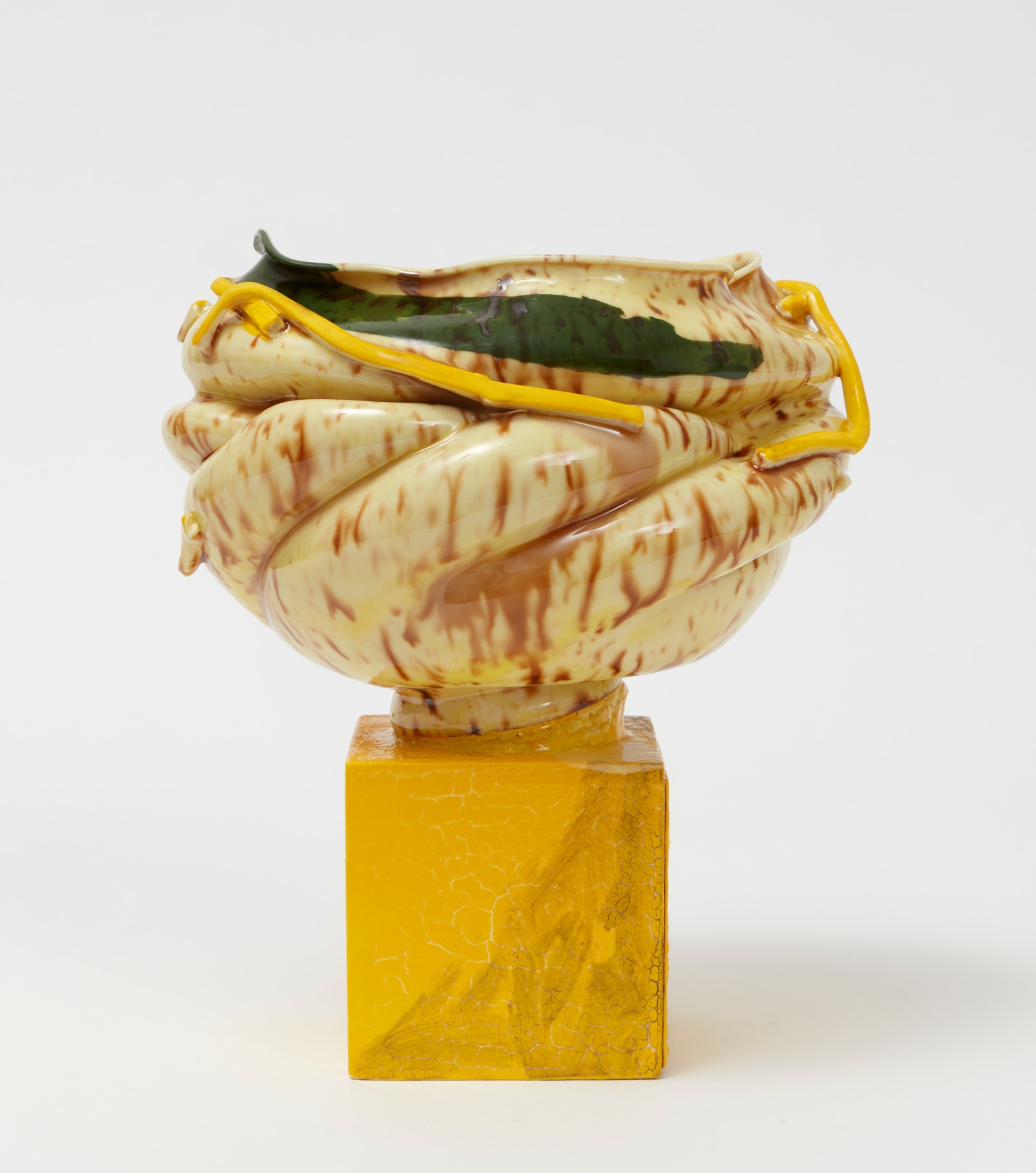 Porcelain pot with a conch-shell-esque shape and pieces of porcelain adhered to the outside by Kathy Butterly.