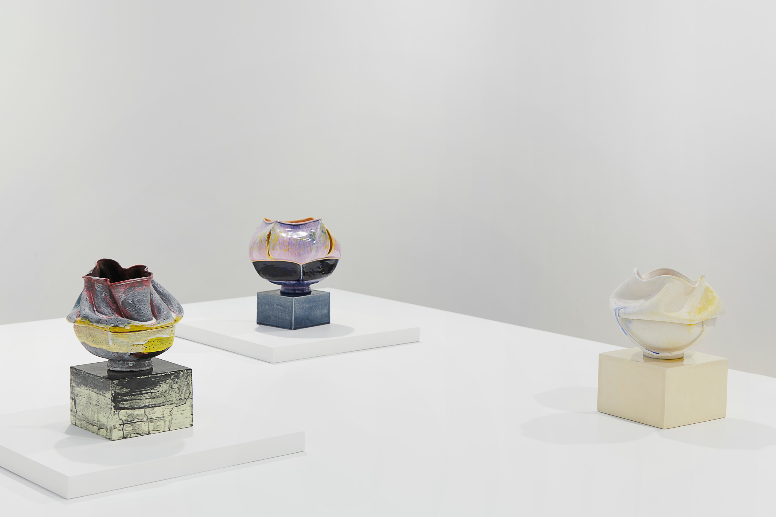 close up of three small artworks