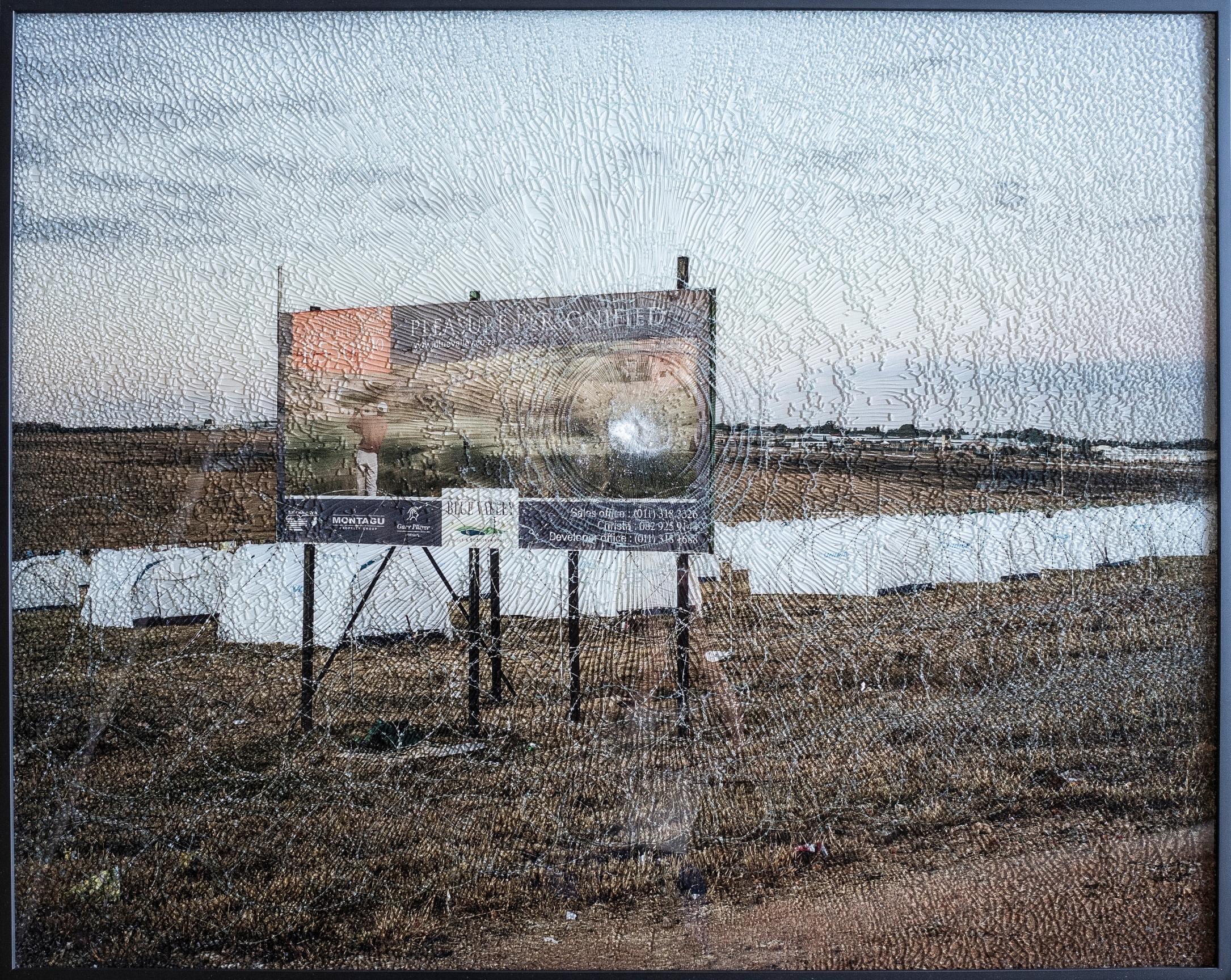 framed photograph with broken glass