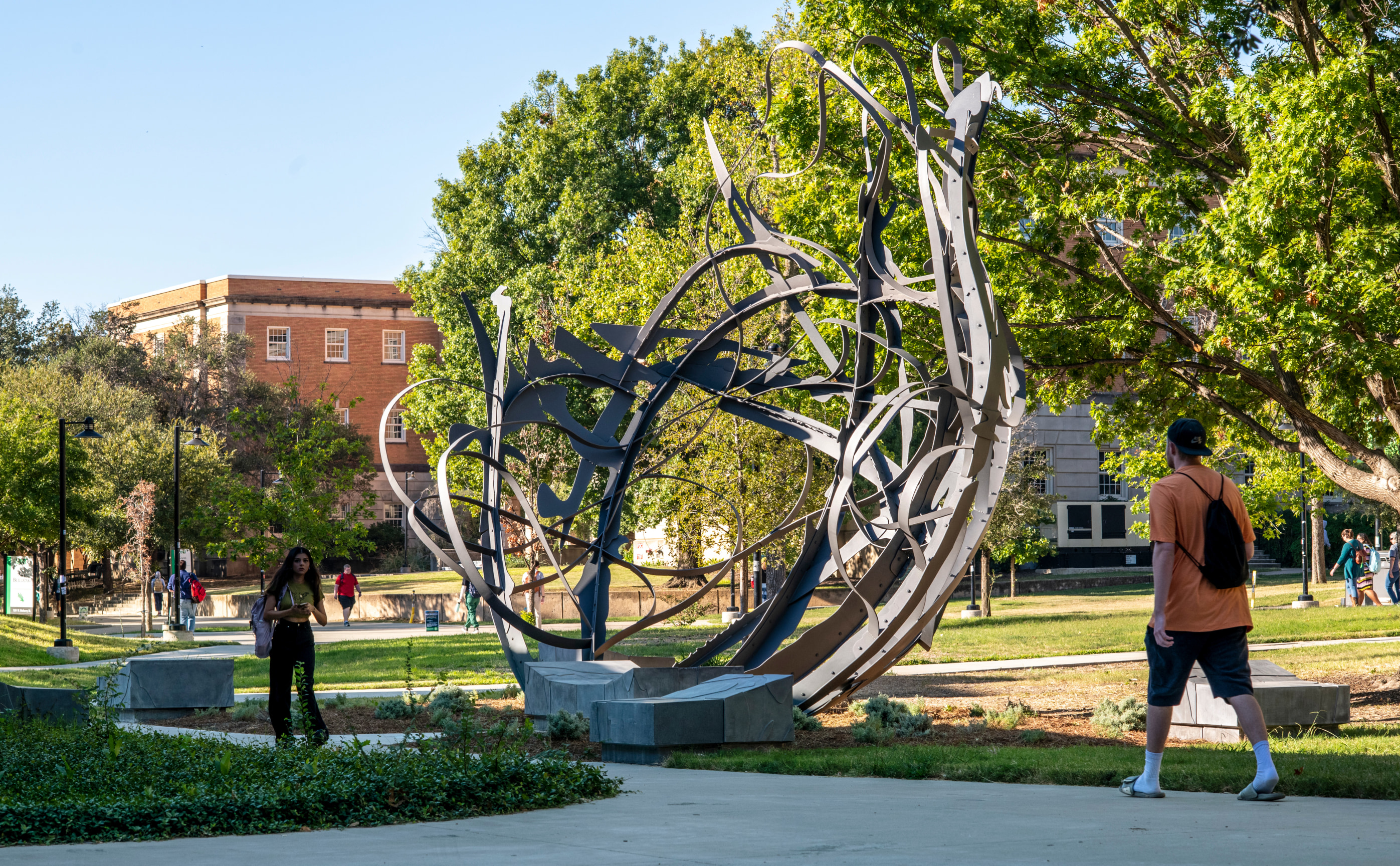 Matthew Ritchie's Shadow Garden, installed on campus, with students walking by