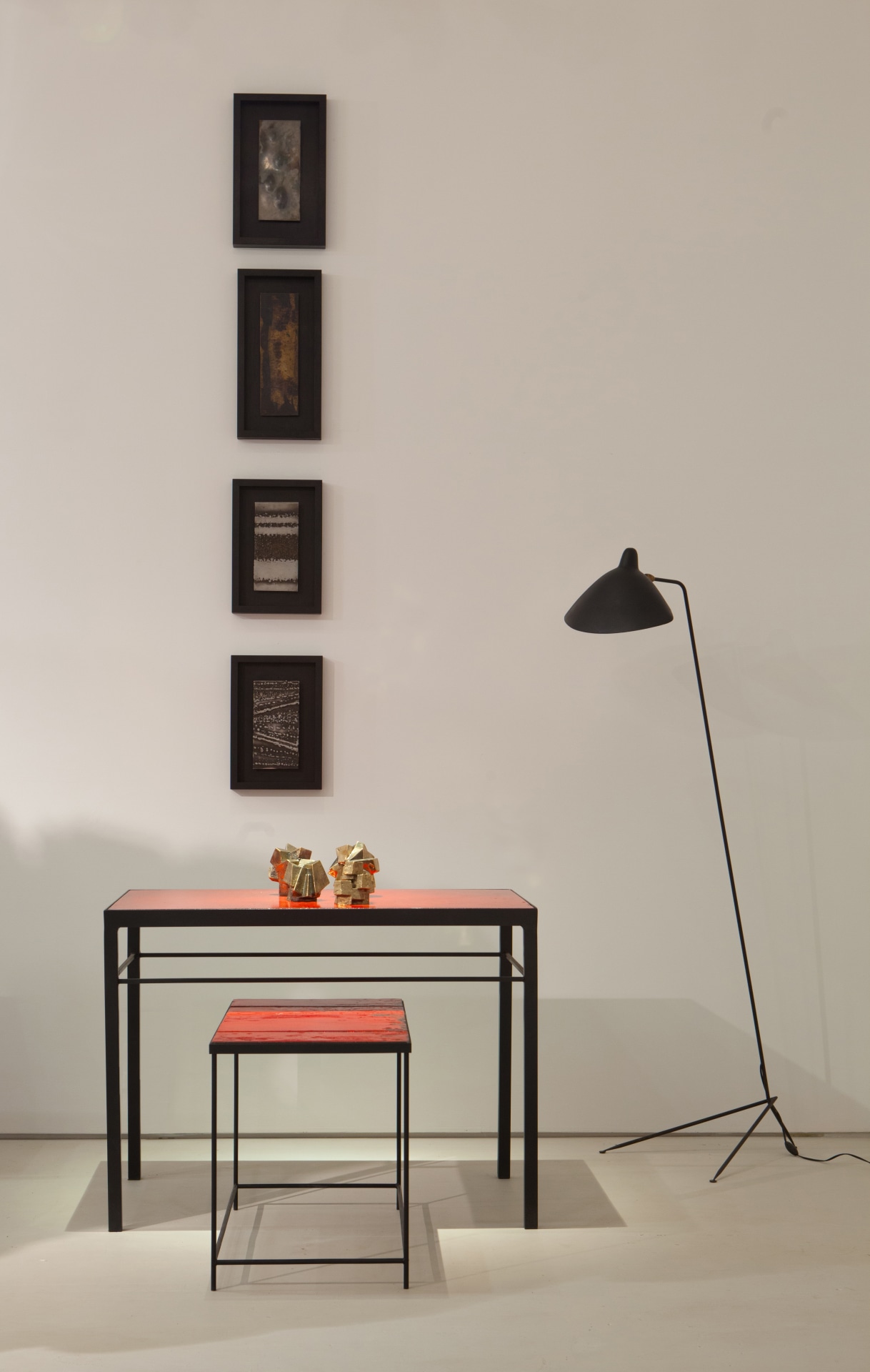 Pierre Sabatier exhibition installation view: displaying four wall sculptures, &quot;Volvic Rouge III&quot; dining table, &quot;Volvic Sang&quot; table, and Serge Mouille floor lamp