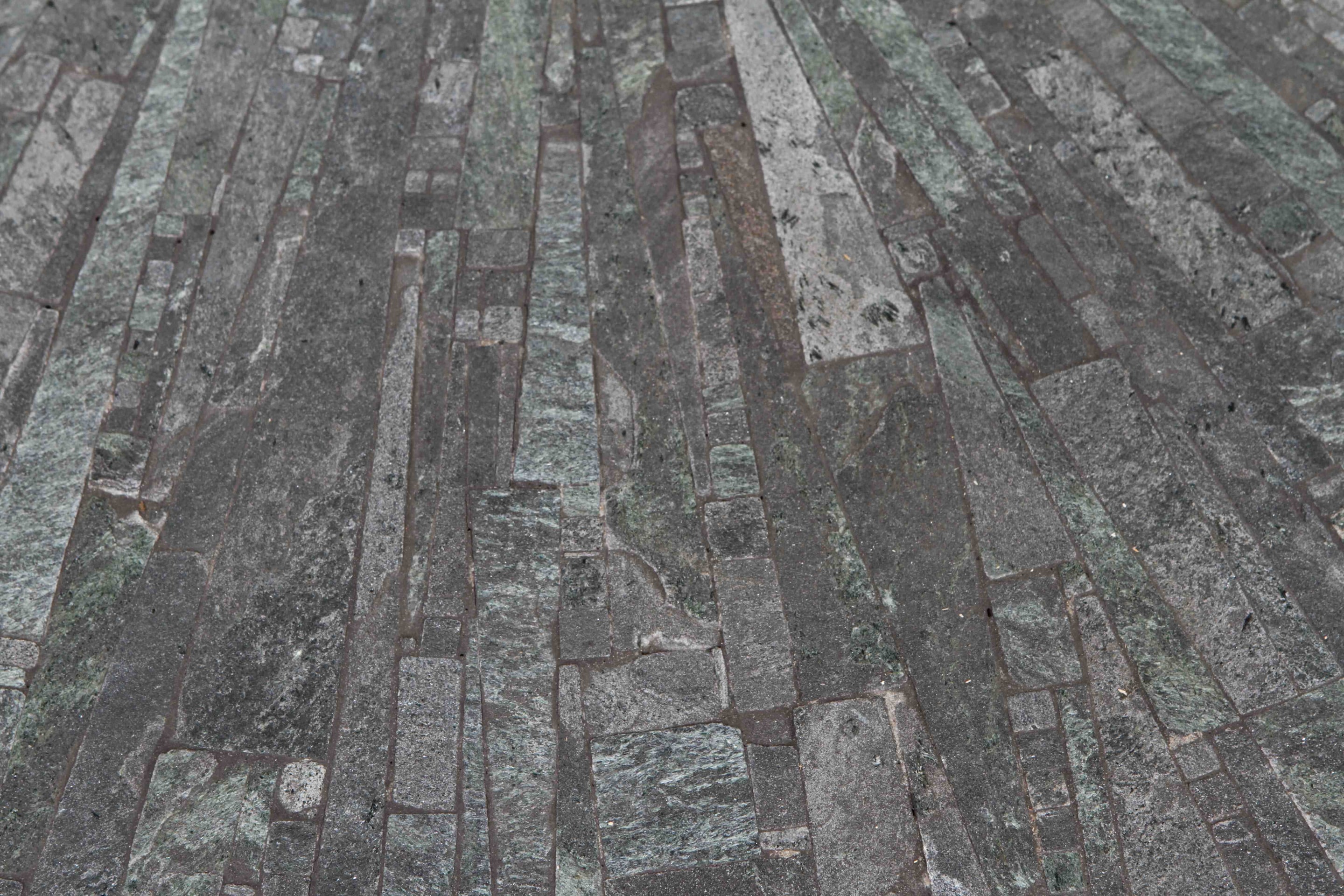 Pia Manu's circular coffee table detailed view of stone table top