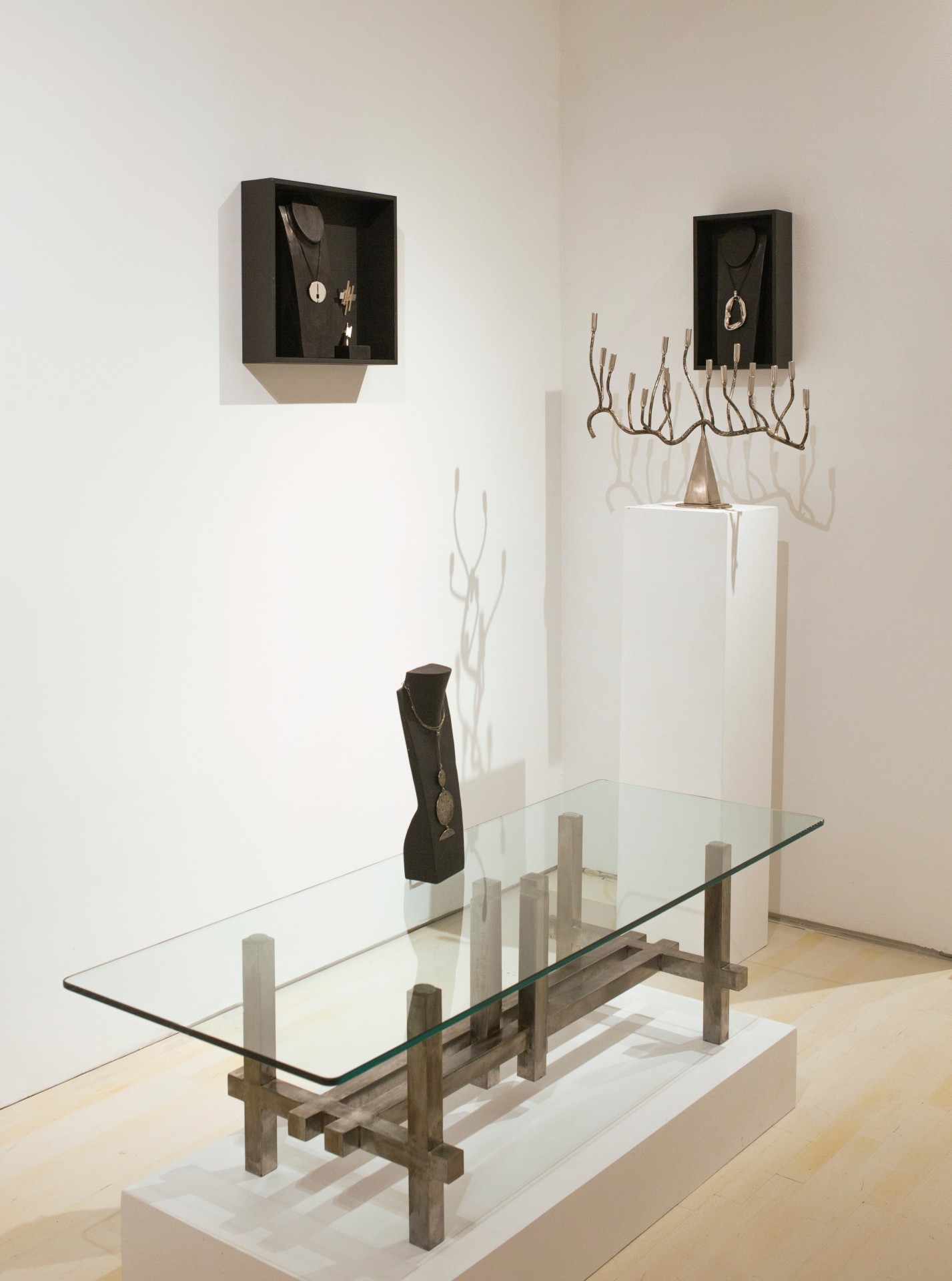 G&eacute;rard Mannoni's sculptural coffee table, Philolaos Tloupas' sculptural necklace, Marino di Teana's pendants and ring, Ren&eacute; Broissand's Candelabra and pendant