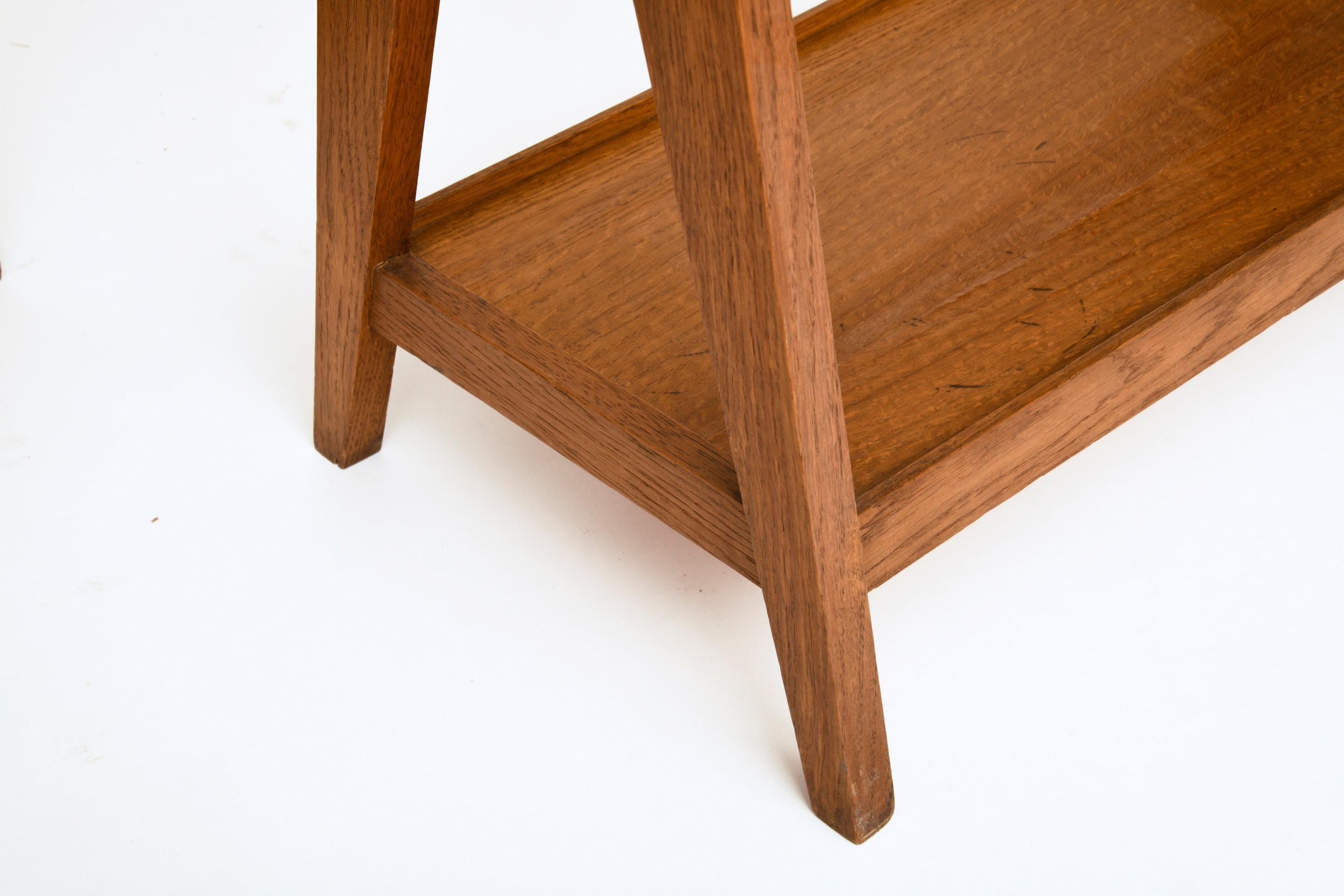 Unknown artist's pair of racks, detailed view of shelf on bottom and feet