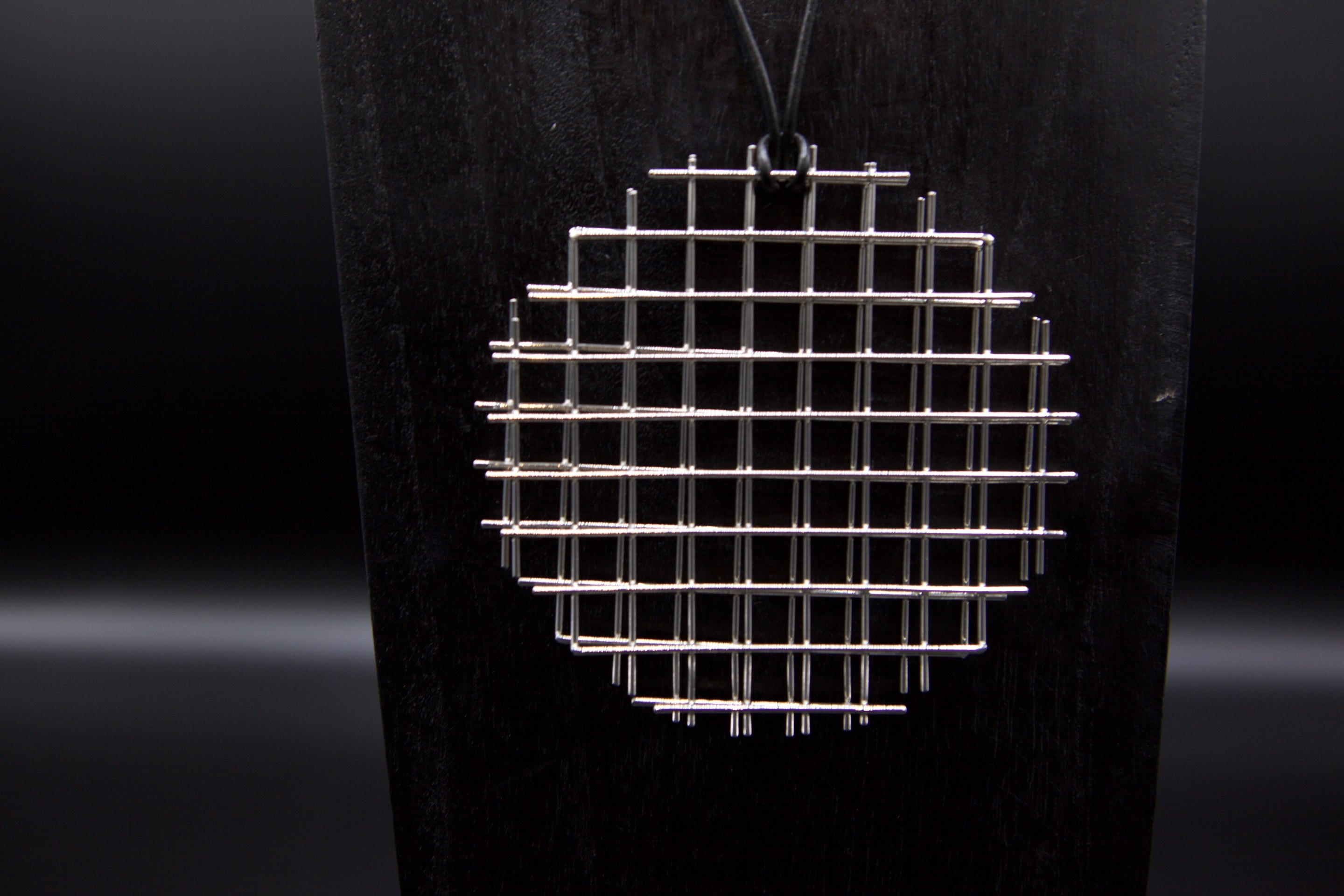 François Morellet's &quot;Trame Disques quadrillés argentés&quot; necklace, detailed view of pendant