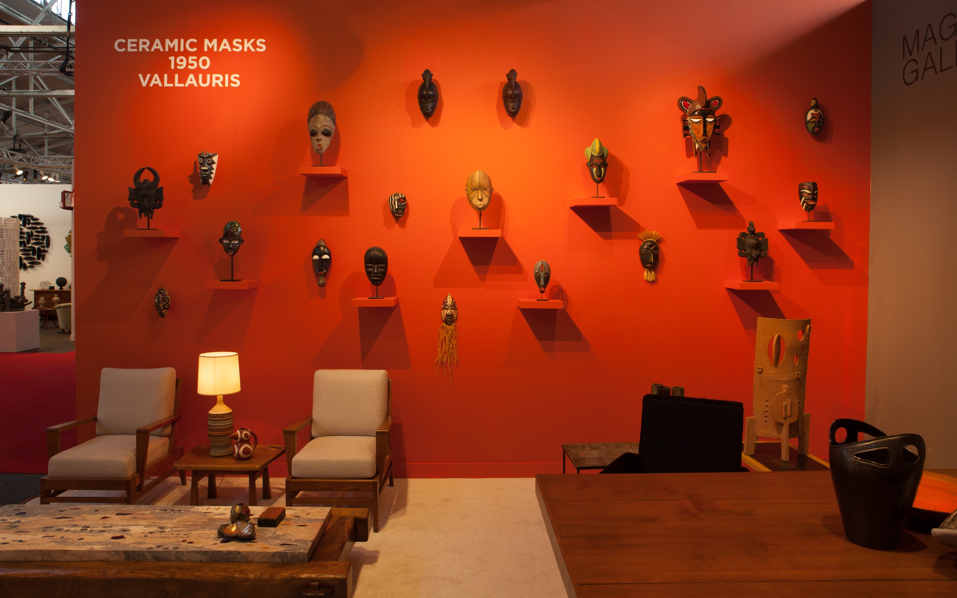 Installation image of booth, wall of Vallauris ceramic masks