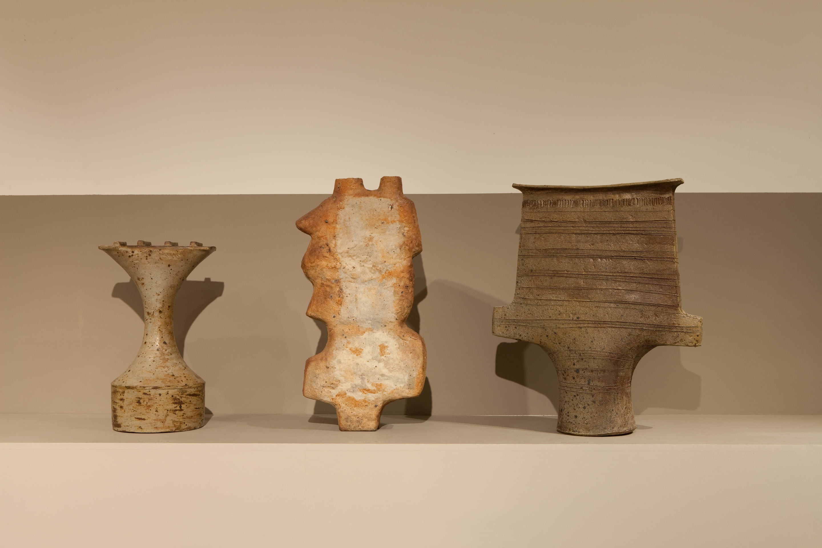 Lined up view of ceramic pieces from left to right: Yves Mohy's vase (c. 1974), Jean and Jacqueline Lerat's commissioned piece (c. 1969), and Gustave Tiffoche's vase (c. 1975)