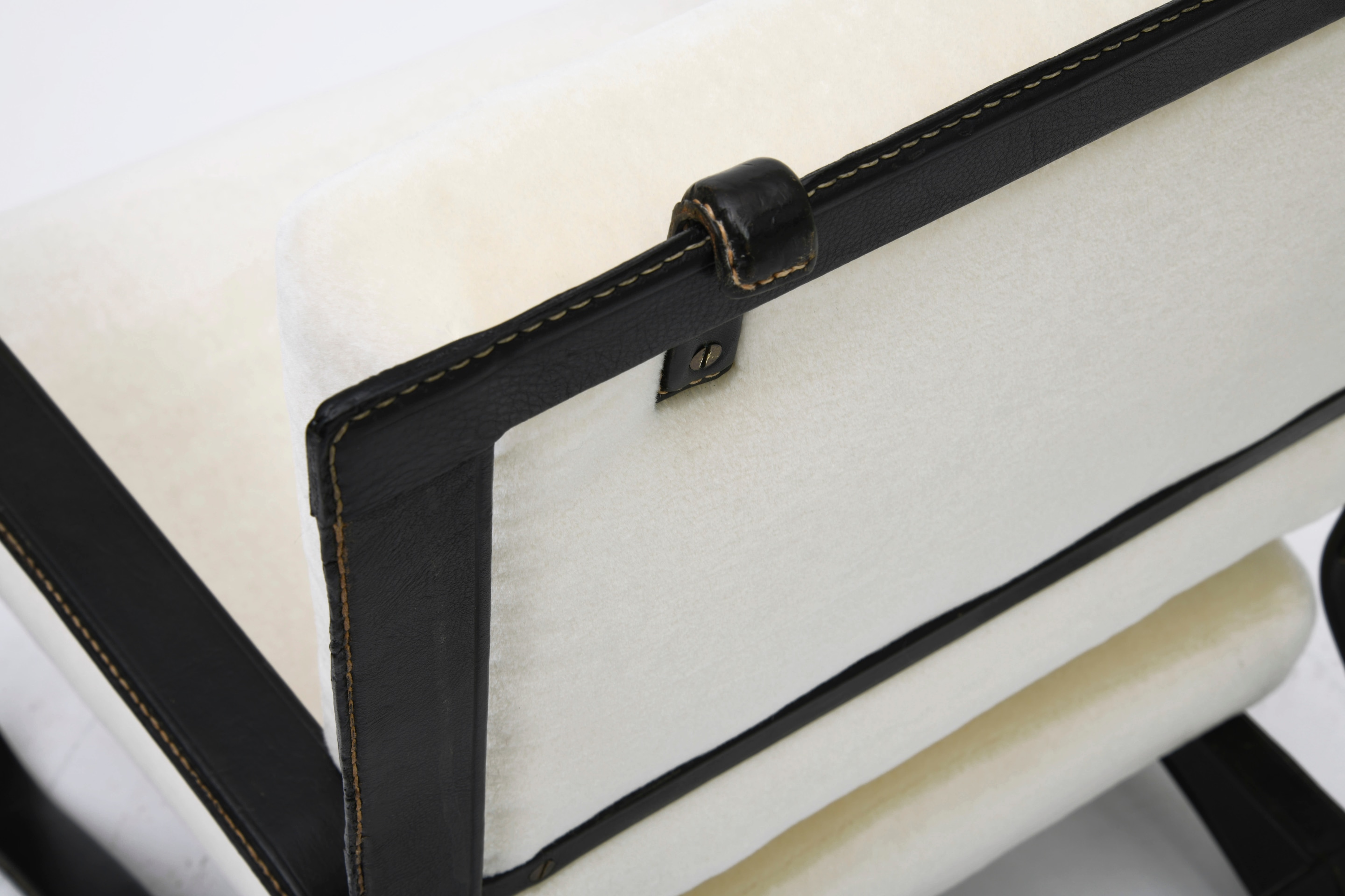 Jacques Adnet pair of armchairs detail of black leather frame