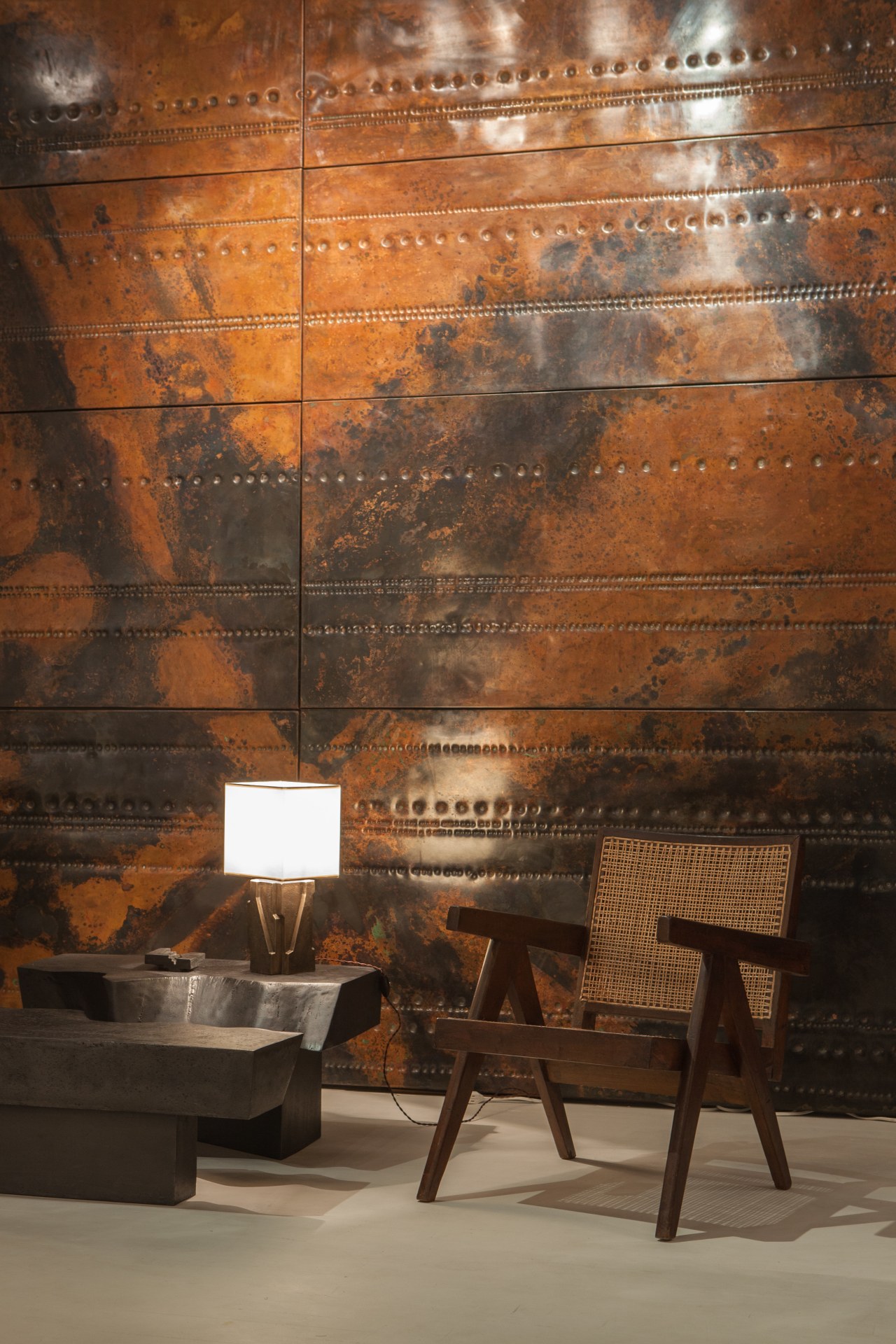 Pierre Sabatier exhibition installation view: displaying Pierre Jeanneret's easy armchairs, Sabatier's &quot;San Andreas&quot; coffee table and &quot;Beauvais I&quot; table lamp in front of &quot;Cosmos 68-04&quot; set of 3 panels, from Tour Aquitaine, La Defense (Hauts-de-Seine)