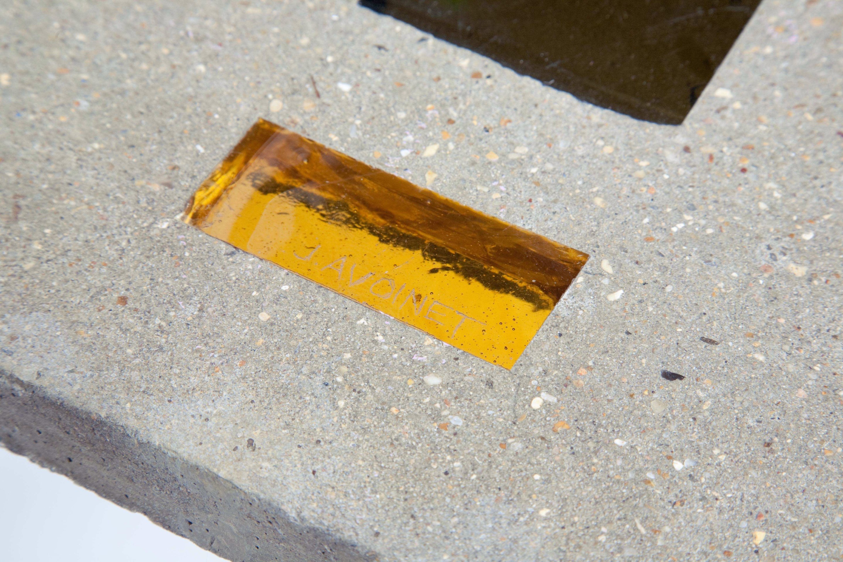 Jacques Avoinet's coffee table detail of glass inserts and concrete table top