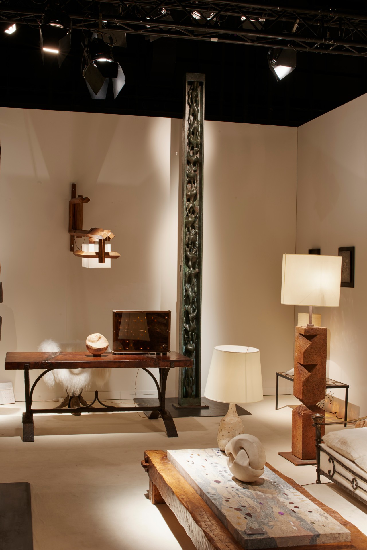 Magen H Gallery's booth at Design Miami/Basel, displaying Sido &amp; Francois Thevenin's dining table, Francois Stahly's Chaine d'eau, Paul Becker's coffee table, Marta Pan's sculpture, and Gustave Tiffoche's floor lamp