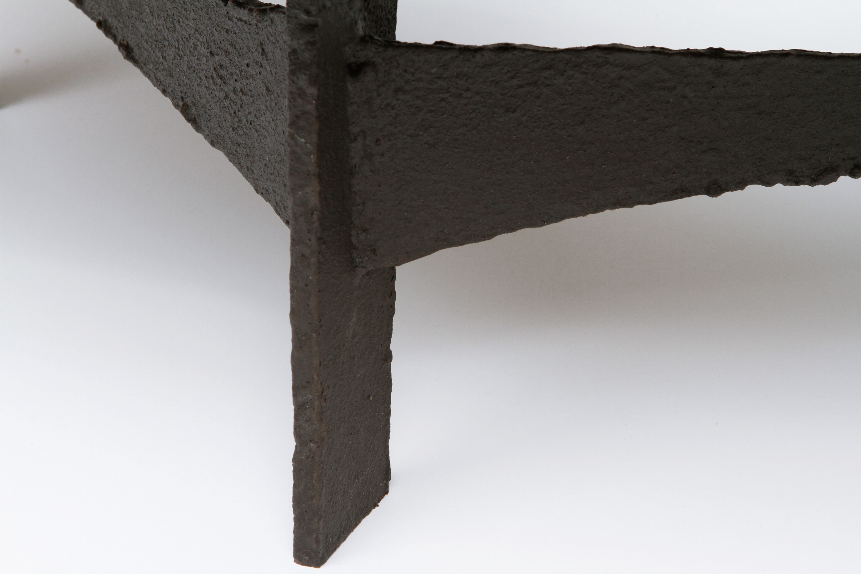 Pia Manu's circular coffee table detailed view of metal leg