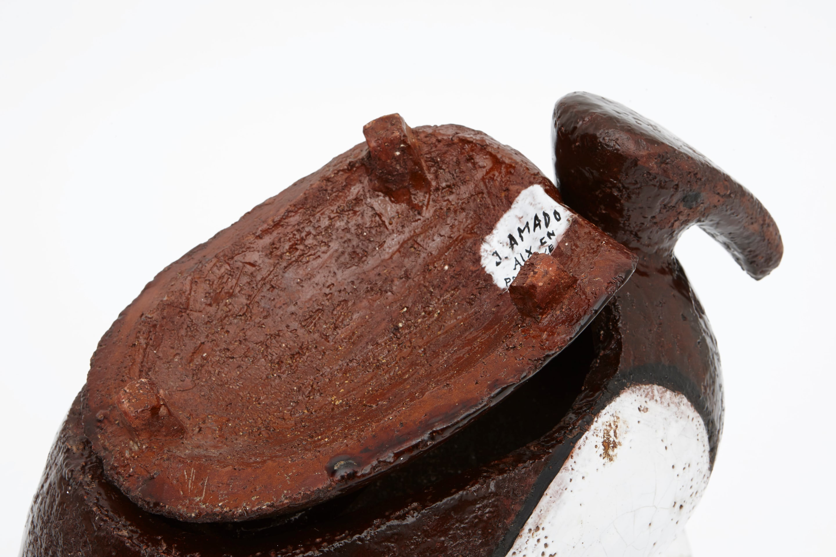 Jean Amado's ceramic pitcher with lid signature detail