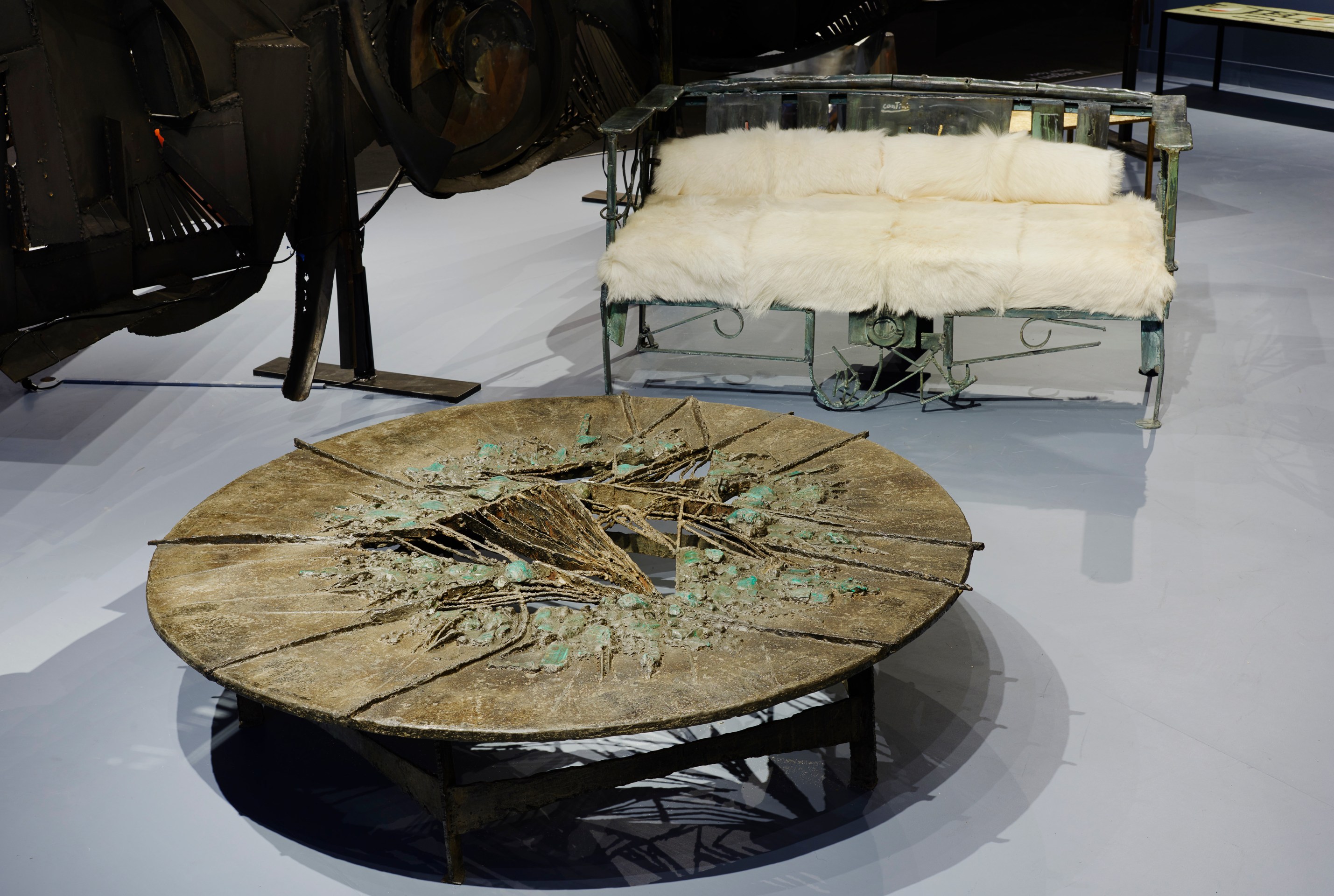 Magen H Gallery's booth at Design Miami, install images of Pia Manu's malachite circular coffee table and Sylvain Contini's sculptural bench