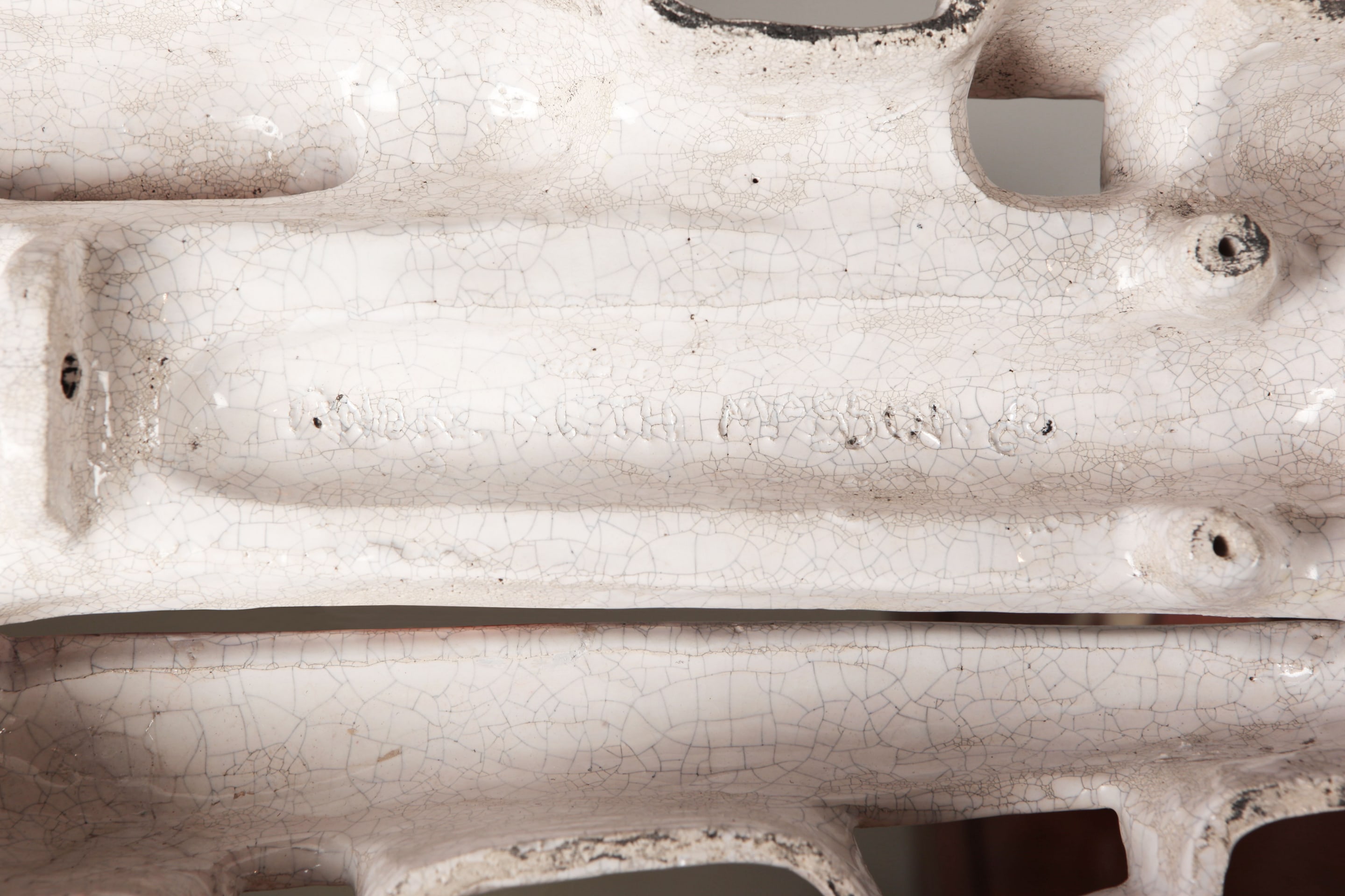 Andre-Aleth Masson's wall sculpture, detailed view of back with signature