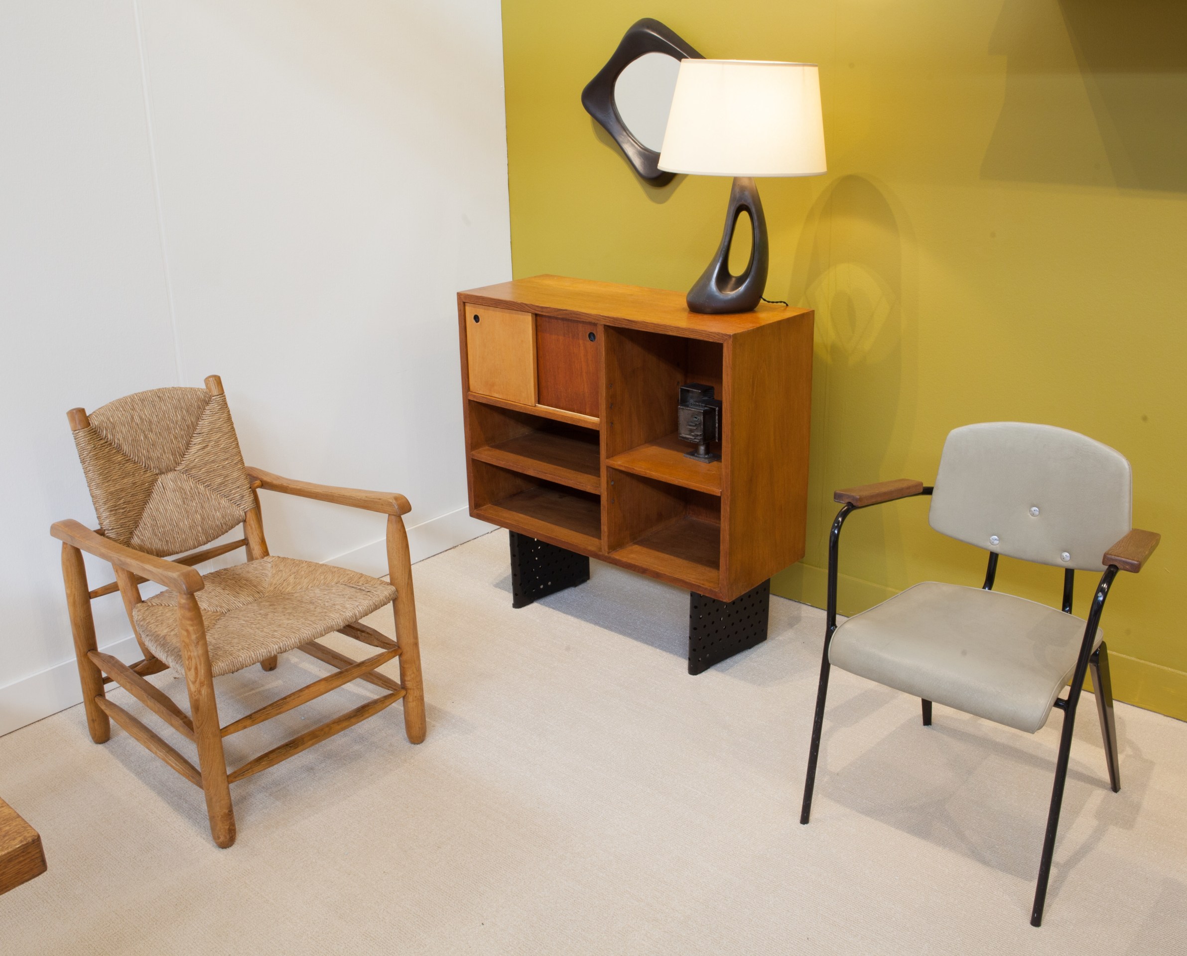 Magen H Gallery's booth at FOG Design + Art, pieces from left to right are Charlotte Perriand's armchair, Escande's cabinet, Marcel Asselbur's mirror, Peter Orlando's table lamp and Jean Prouv&eacute;'s Conference No 355 chair