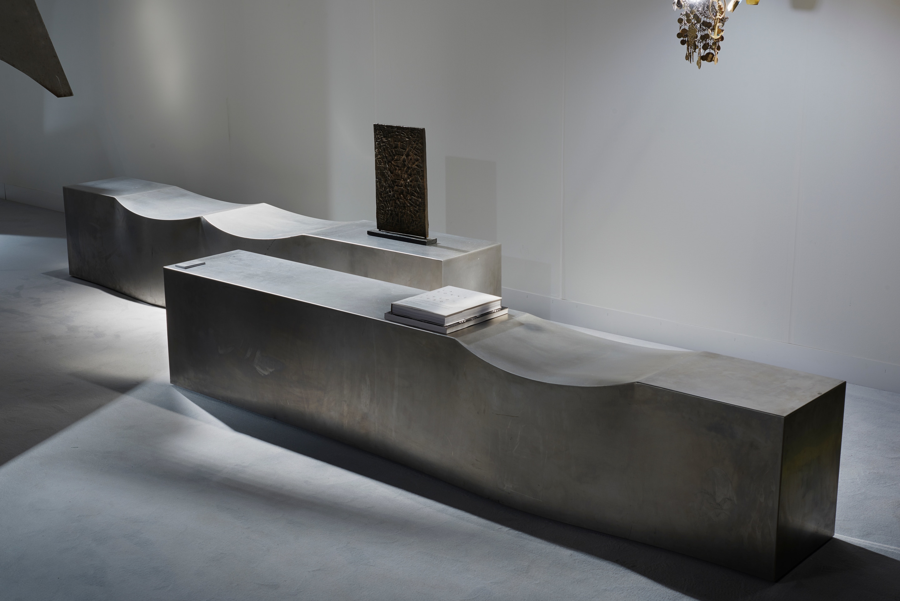 Magen H Gallery's booth at Design Miami/Basel, installation view of Chris Howker's pair of double dip bench and Francois Stahly's sculpture