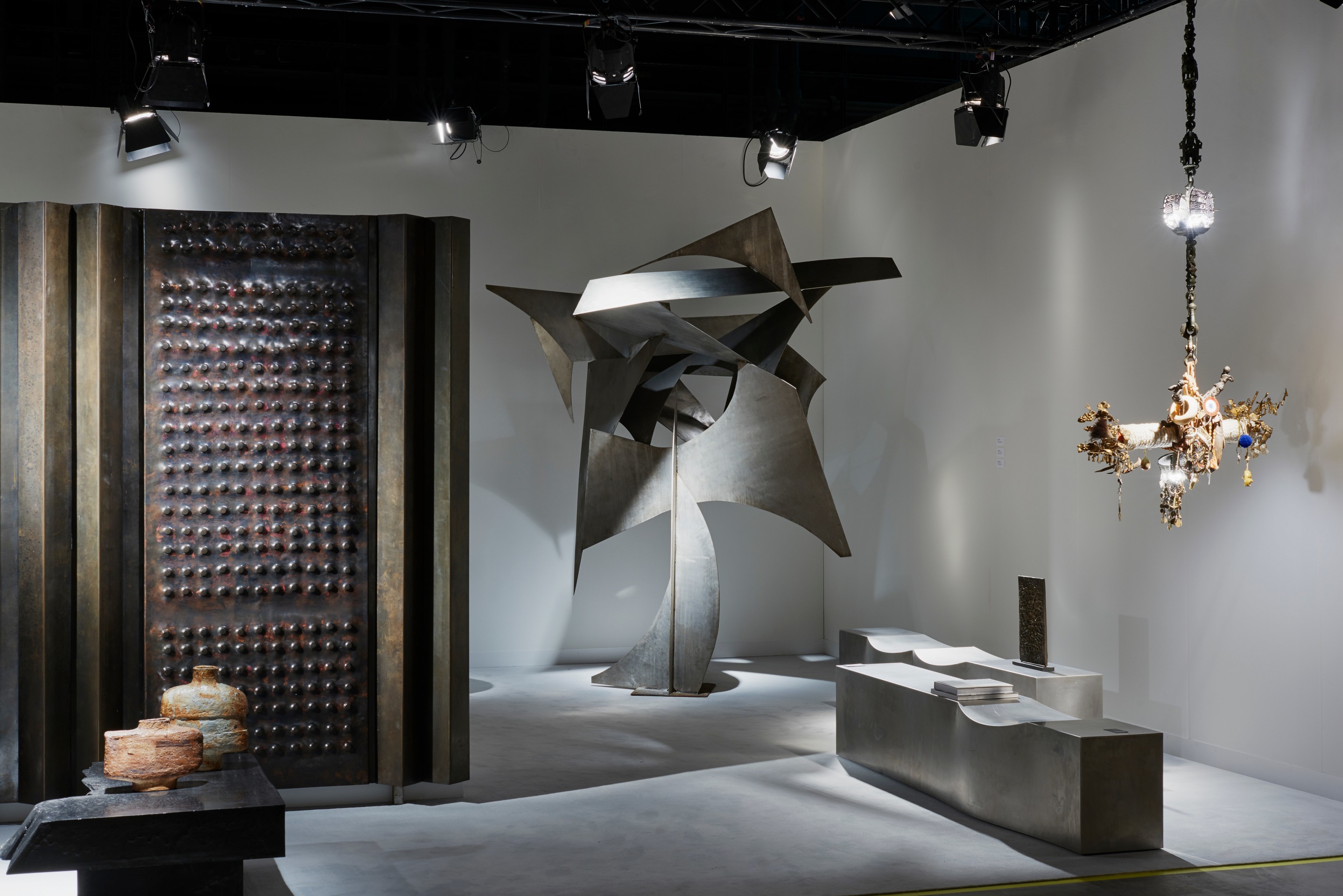 Magen H Gallery's booth at Design Miami/Basel, installation view showing Albert Feraud's sculpture and Chris Howker's pair of double dip bench