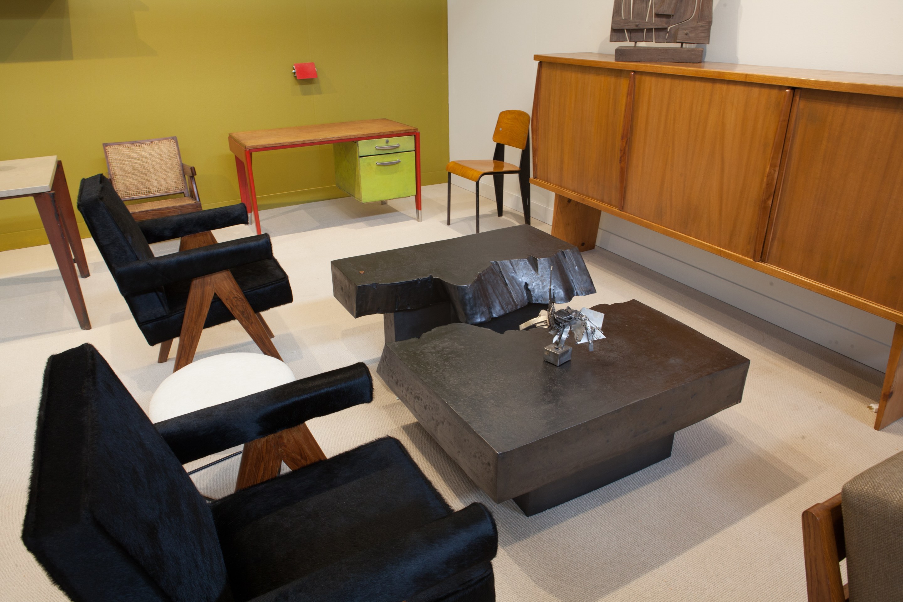 Magen H Gallery's booth at FOG Design + Art, pieces from left to right Pierre Jeanneret's pair of &quot;Committee&quot; armchairs, Jean Prouv&eacute;'s Dactylo desk, Charlotte Perriands &amp; Pierre Jeanneret's sideboard, Pierre Sabatier's San Andrea's coffee table, and Albert Feruad's sculpture