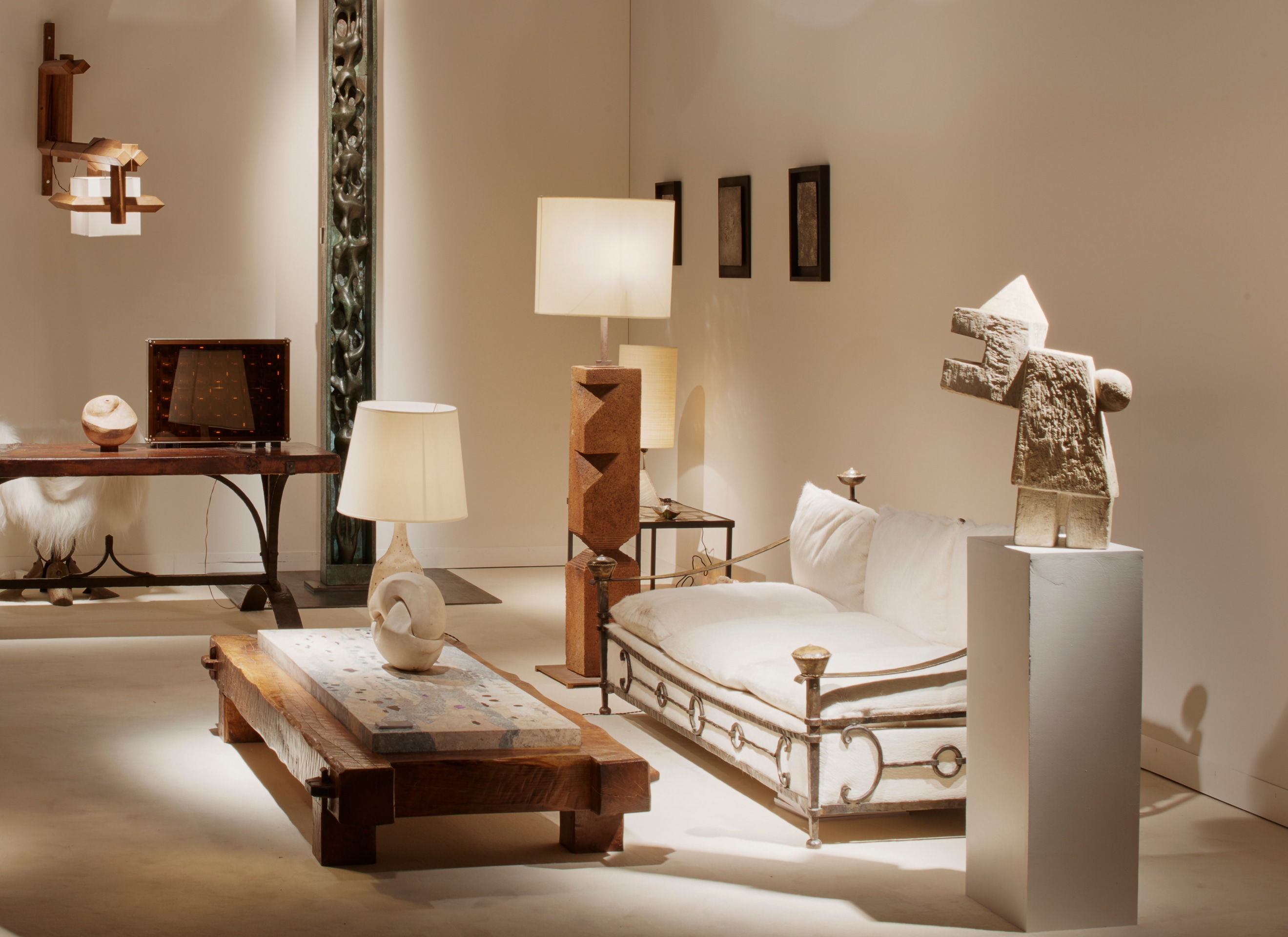 Magen H Gallery's at Design Miami/Basel, displaying Paul Becker's coffee table, Marta Pan's sculpture, Gustave Tiffoche's floor lamp, Sido &amp; Francois Thevenin's sofa, and Pierre Sz&eacute;kely's &quot;Clown&quot; sculpture