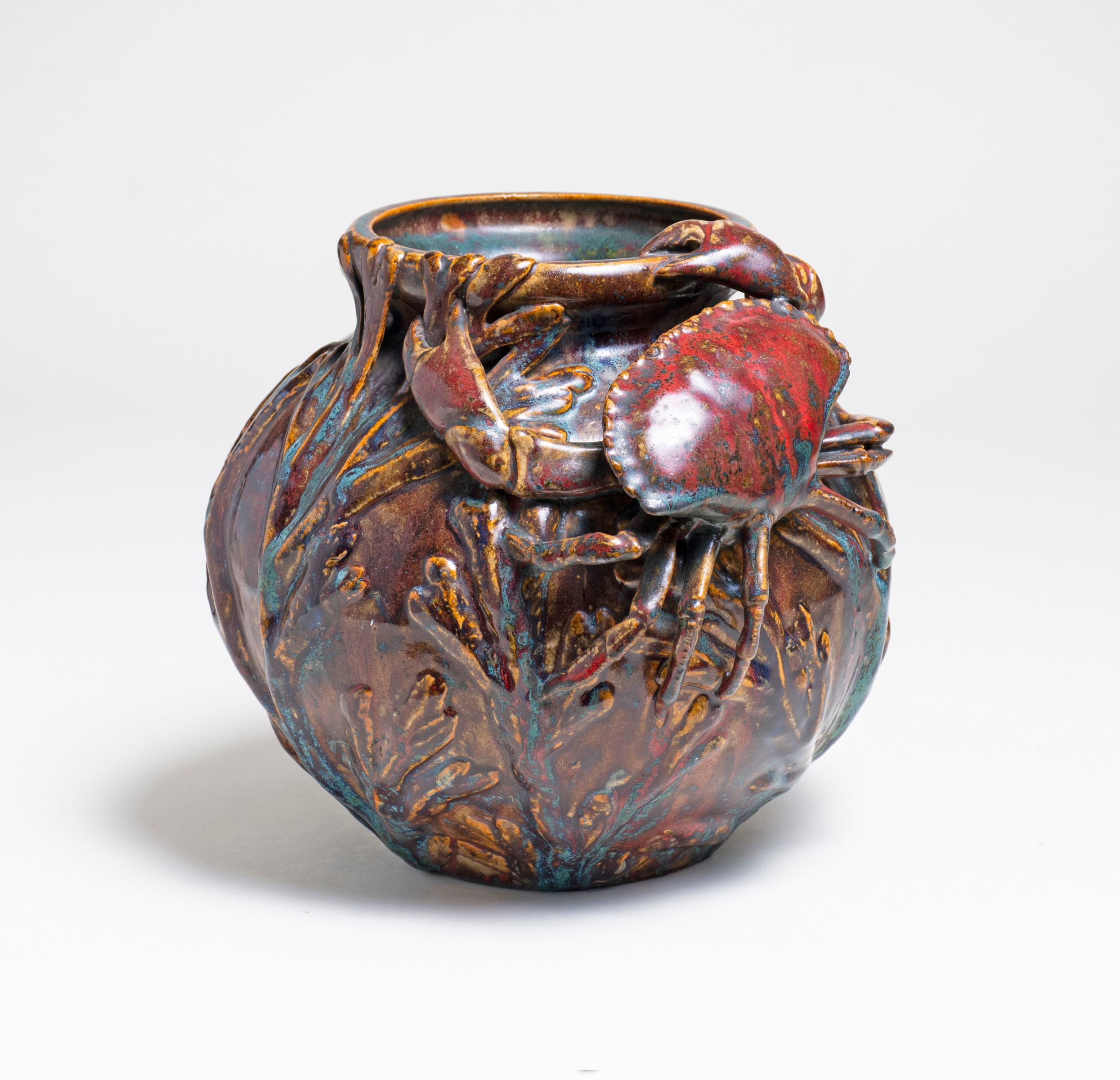 art nouveau vase by pierre adrien dalpayrat showing his famous oxblood glaze, sang de boeuf, with applied motif of crab and seaweed