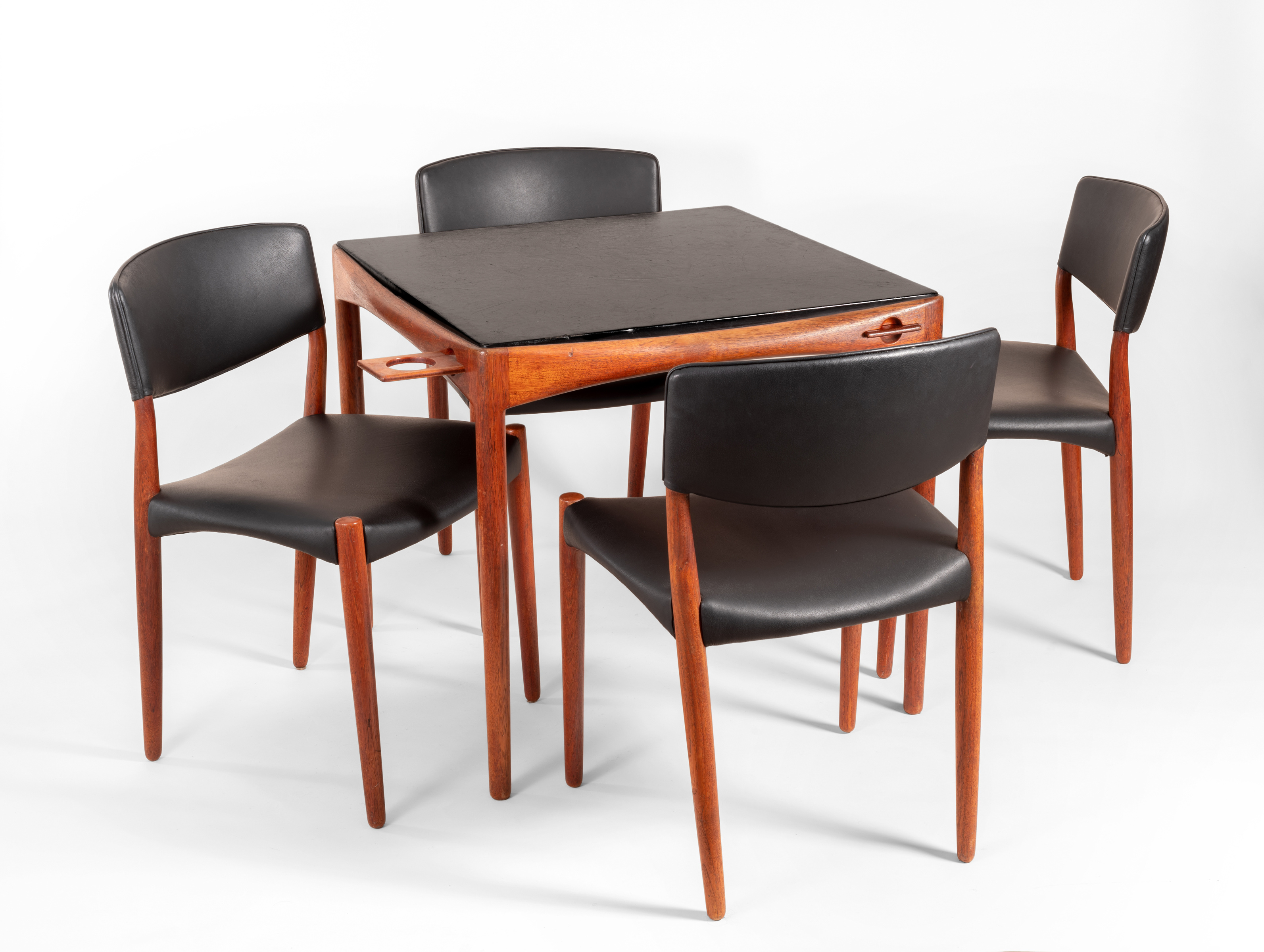 a danish midcentury wood and leather game table with matching set of chairs
