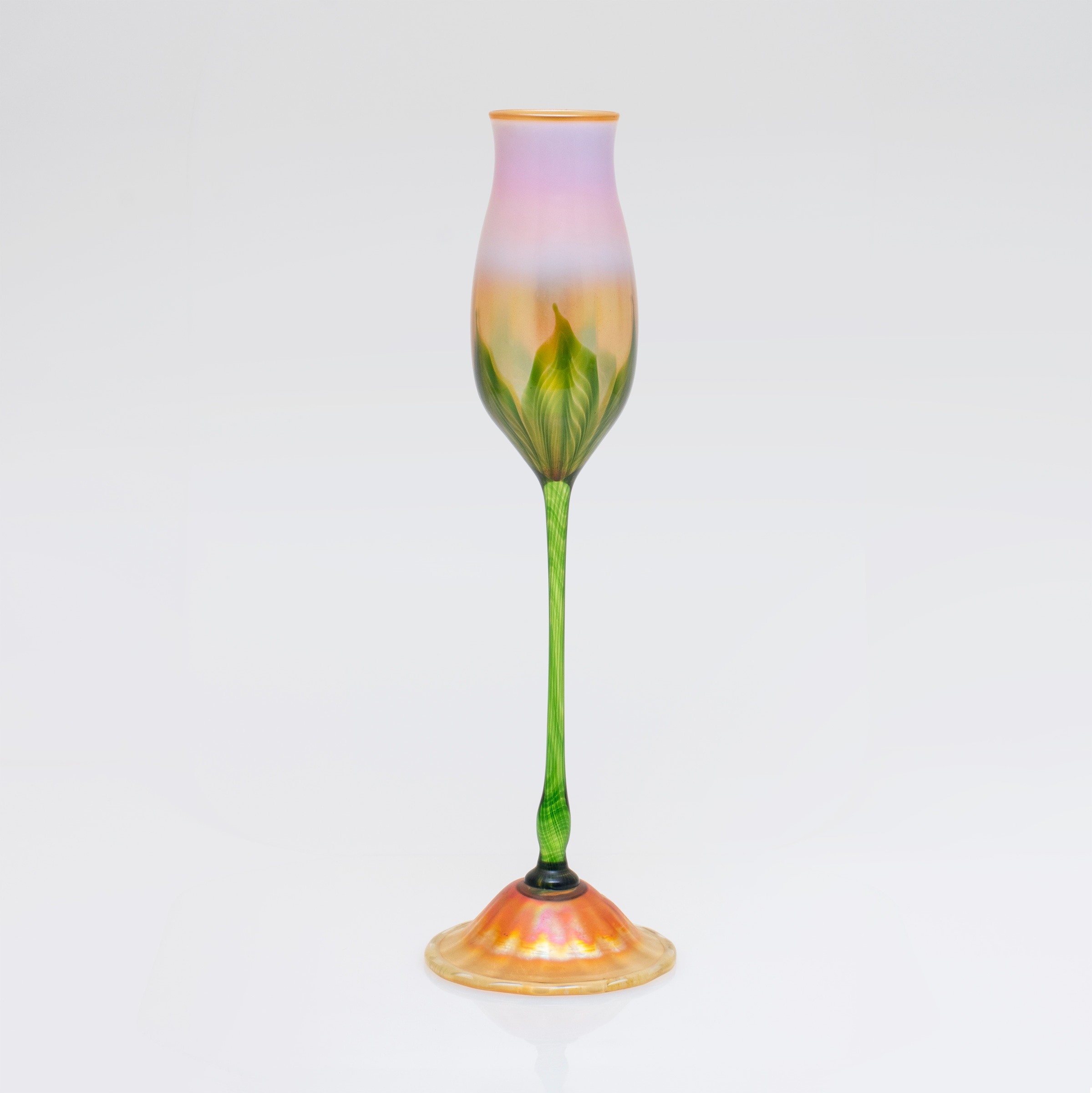 a tall tiffany favrile glass vase known as a flower form of floriform vase, a sculpture representing a flower in glass.