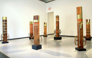 Installation image of columns from Paul Kasmin's Robert Indiana: Wood exhibition