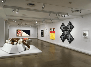 Installation view of Pop Art—Icons That Matter: Collection du Whitney Museum of American Art at the Maillol Museum in Paris with Indiana's LOVE sculpture and X-5 painting
