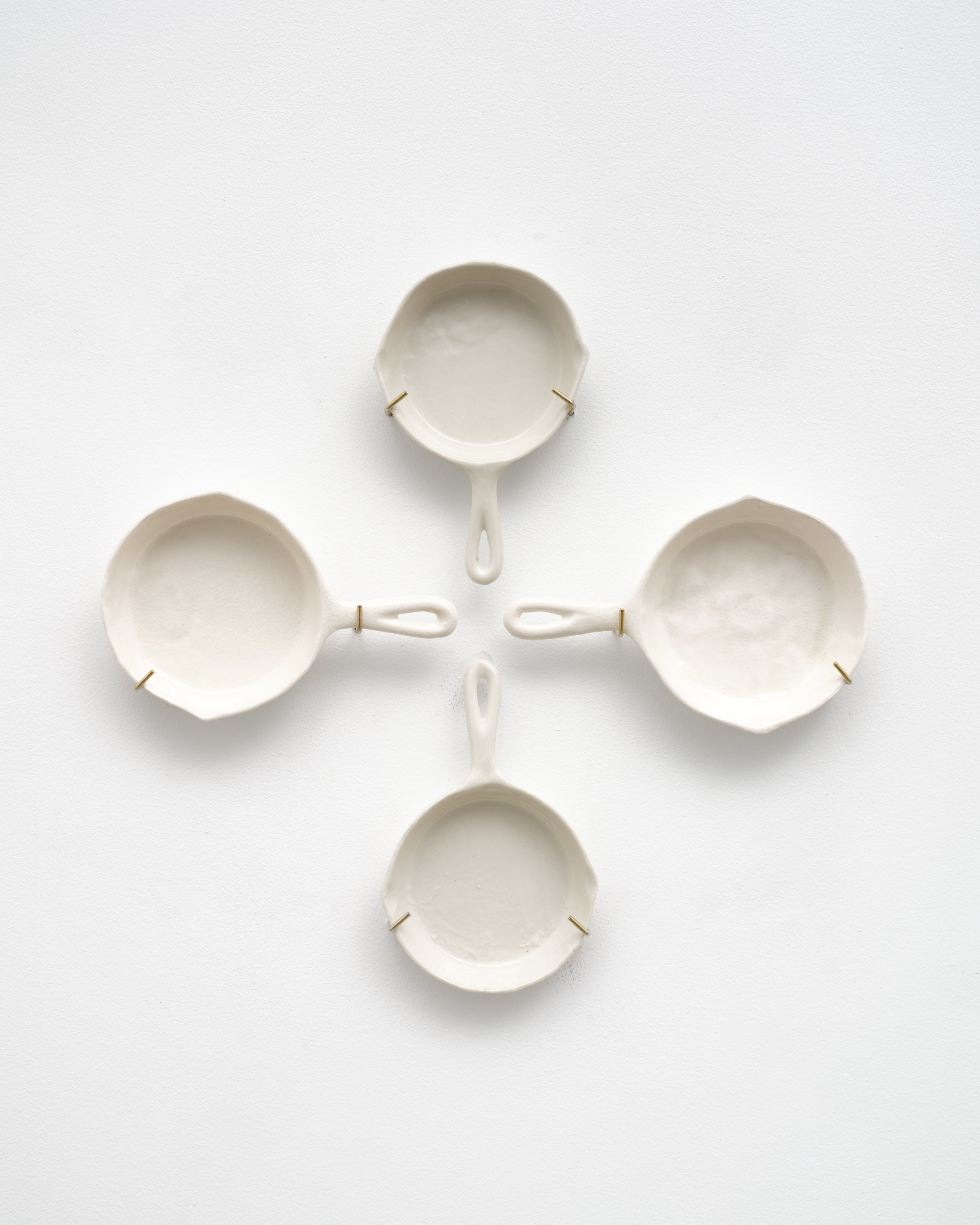 Detail of ceramic cast iron pans in "Fingers of God"