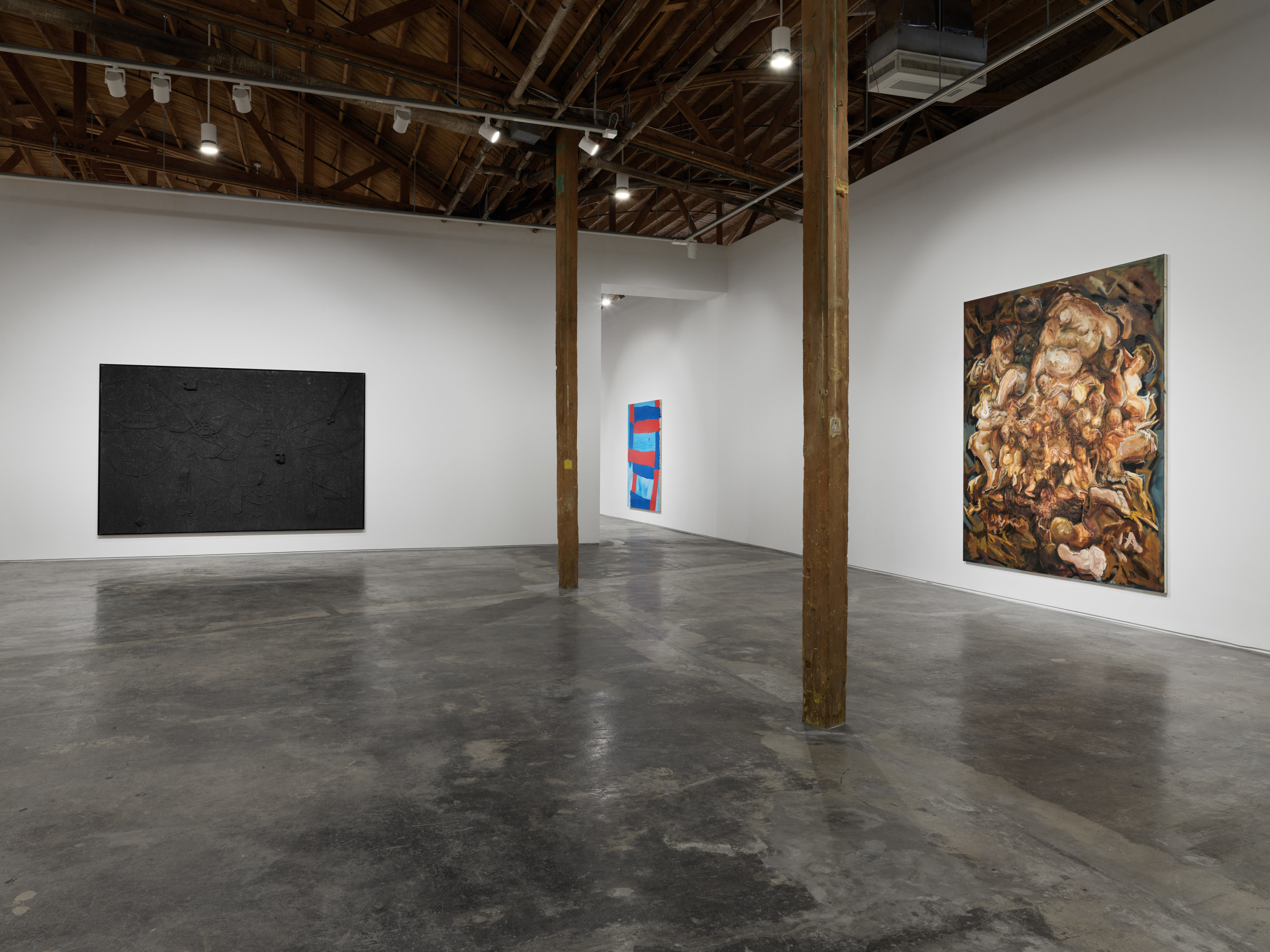 Installation view of the exhibition "The Big Picture" at Night Gallery, including a large scale painting by Radcliffe Bailey, Hasani Sahlahe, and Marcia Falcao. 