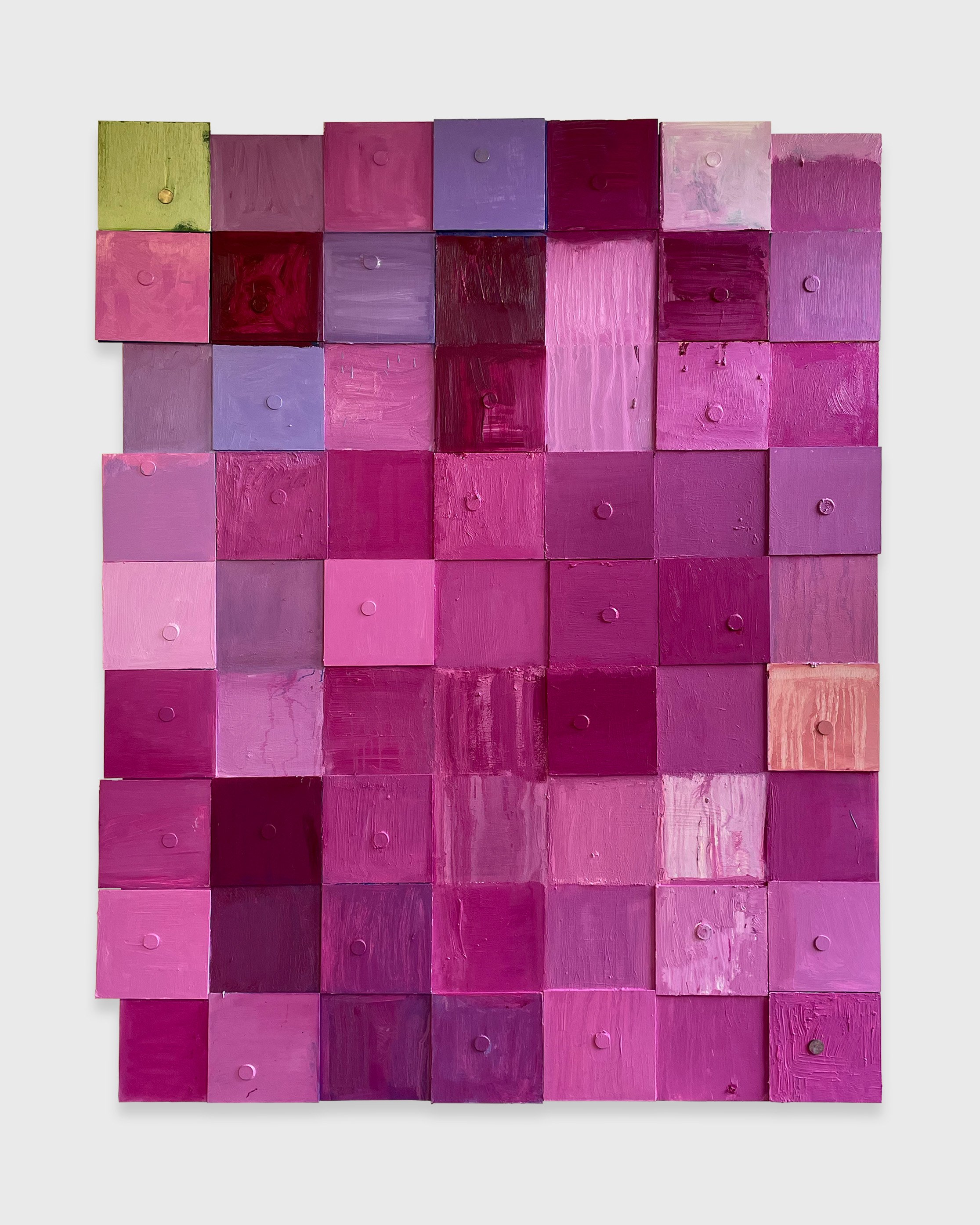 An abstract painting made up of varying shades of purple squares and one green square  magnetized to the canvas.