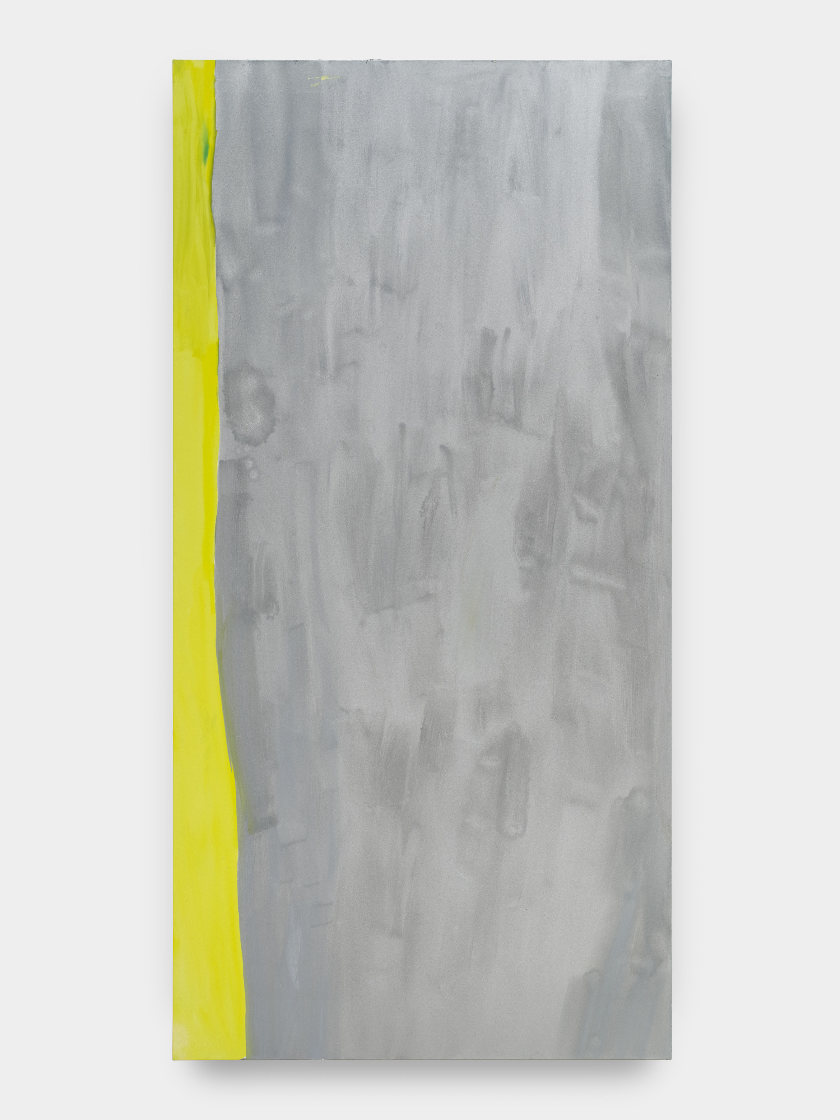 A large vertically rectangular abstract painting in silver with a lime green swatch of color along the left side of the painting.