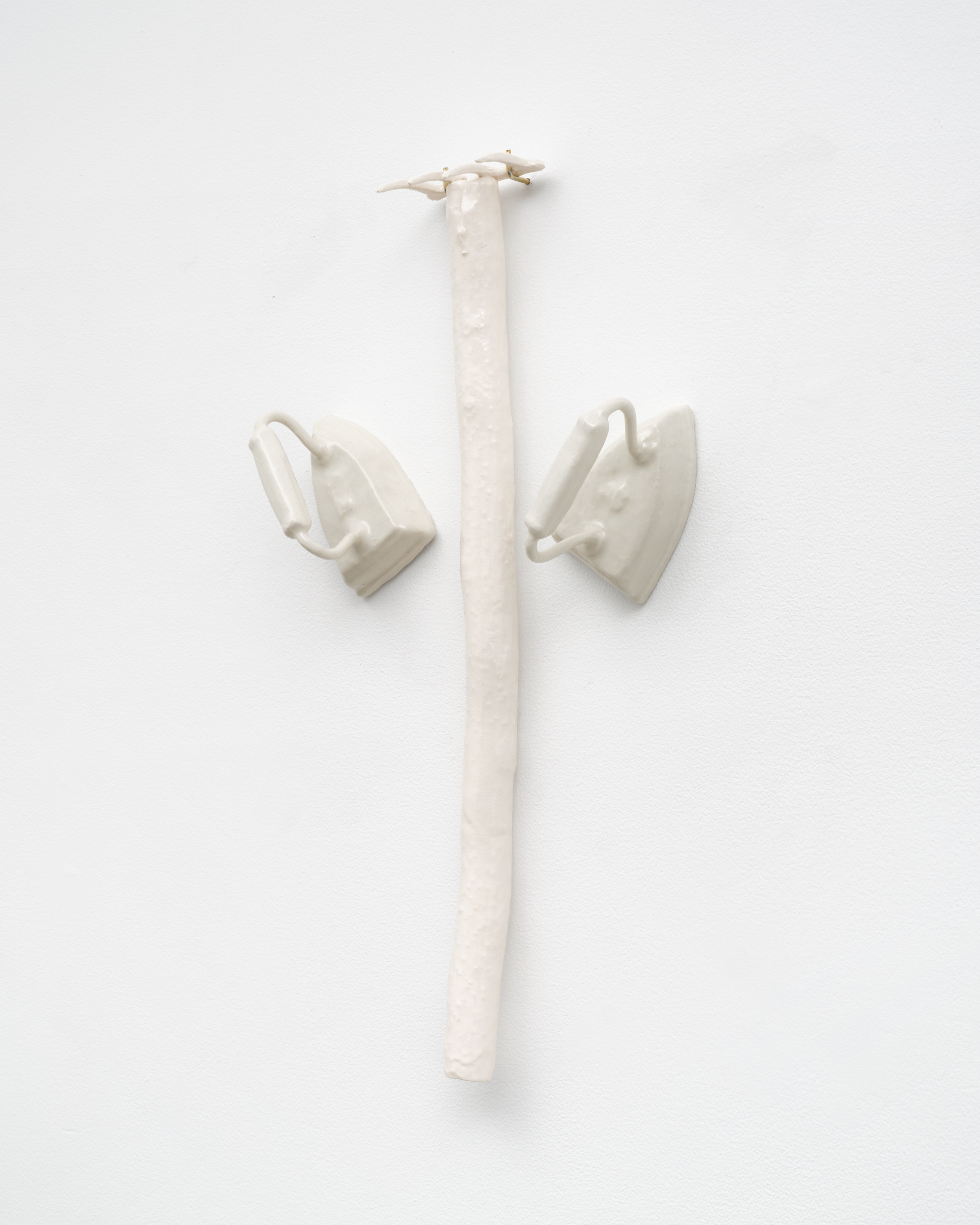 Detail of a ceramic rake and two ceramic irons in "Fingers of God"