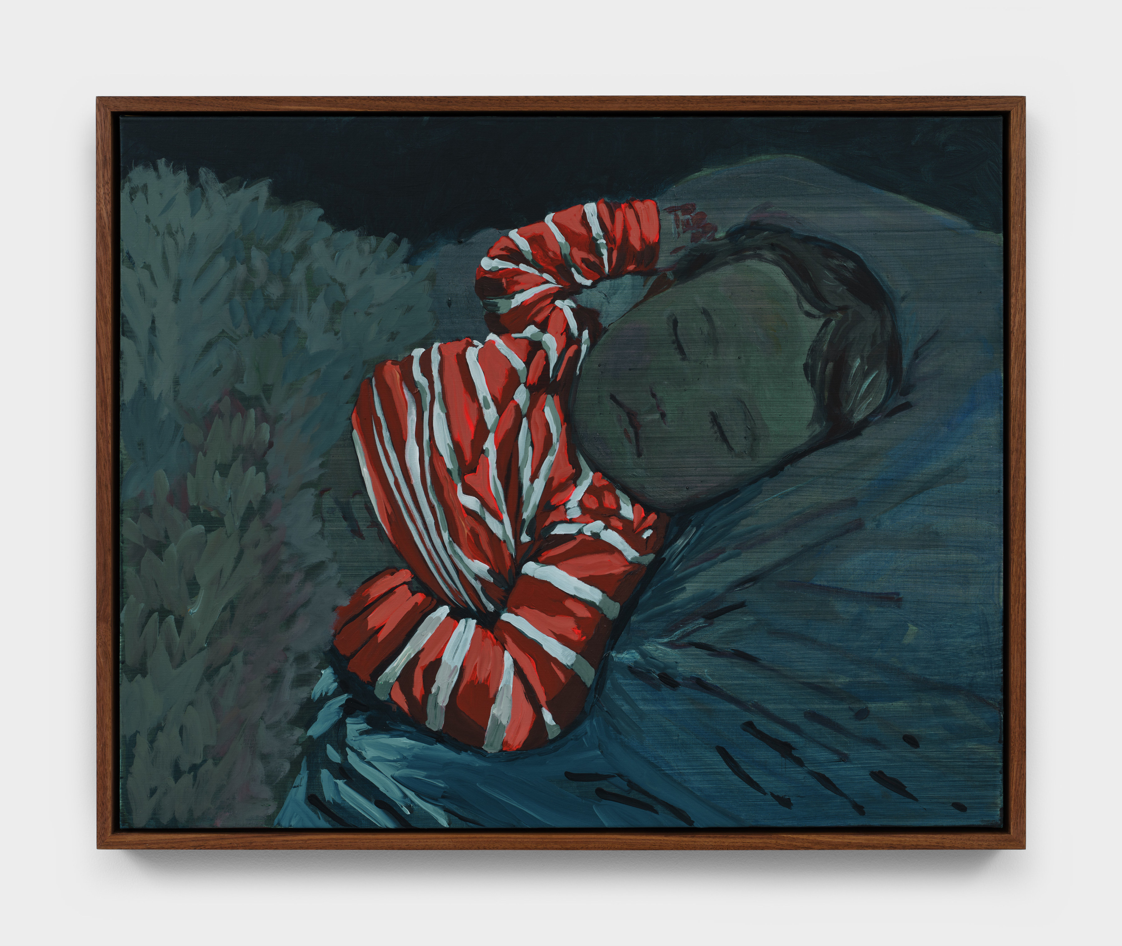 A portrait in deep blue hues of a child asleep in bed wearing a red and white striped top. 