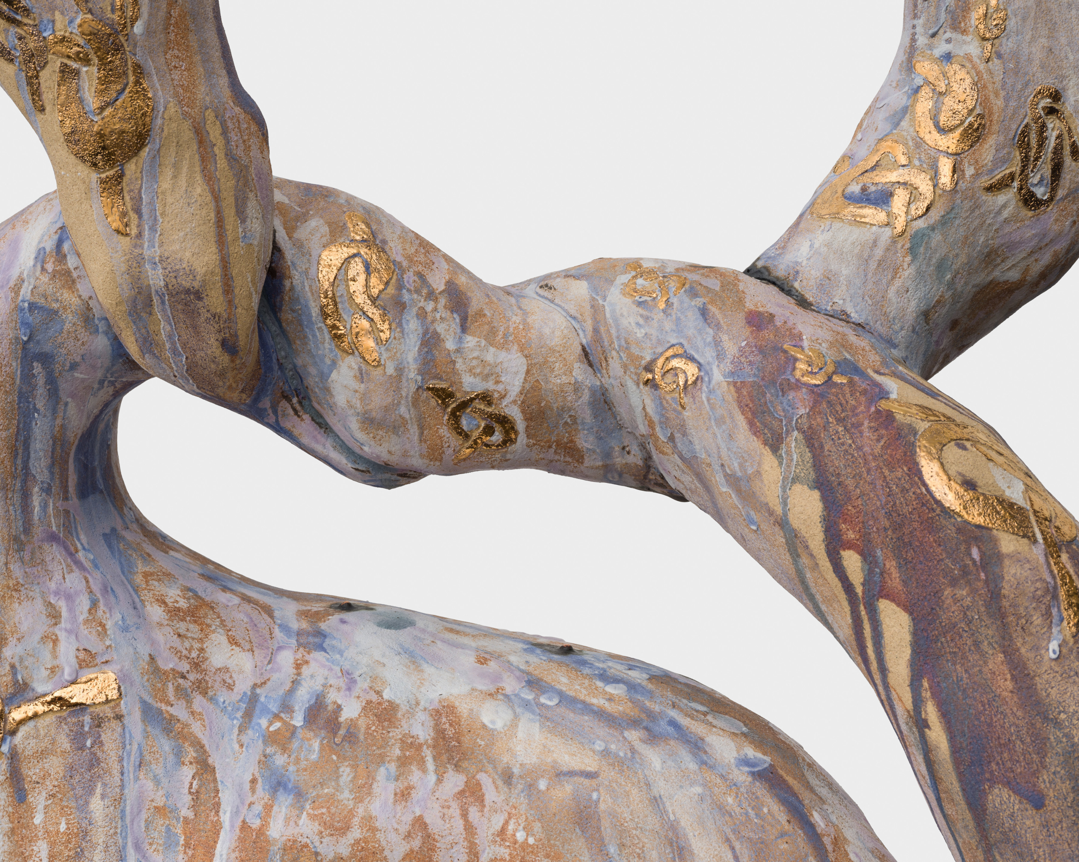 Detail of "Knot with Knots" depicting golden painted knots on the knotted part of the sculpture. 