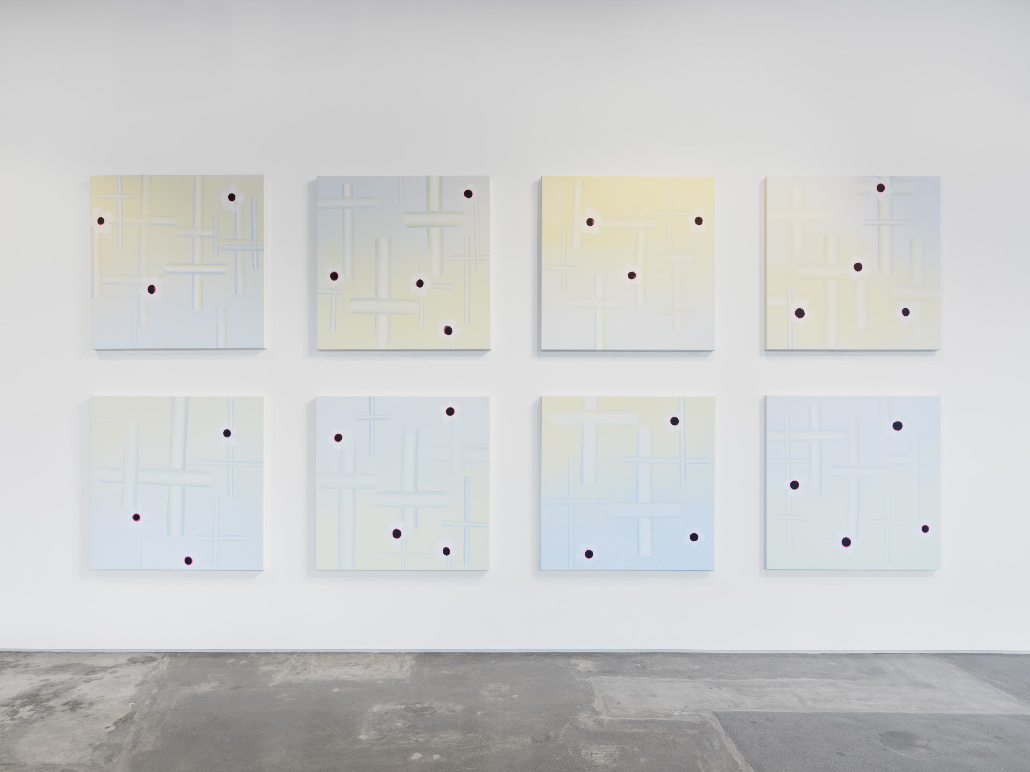 Installation view of Wanda Koop’s “Objects of Interest, Bullet Proof” at Night Gallery. 8 square canvas’ are arranged in two rows, each with depictions of crosses and flowers 