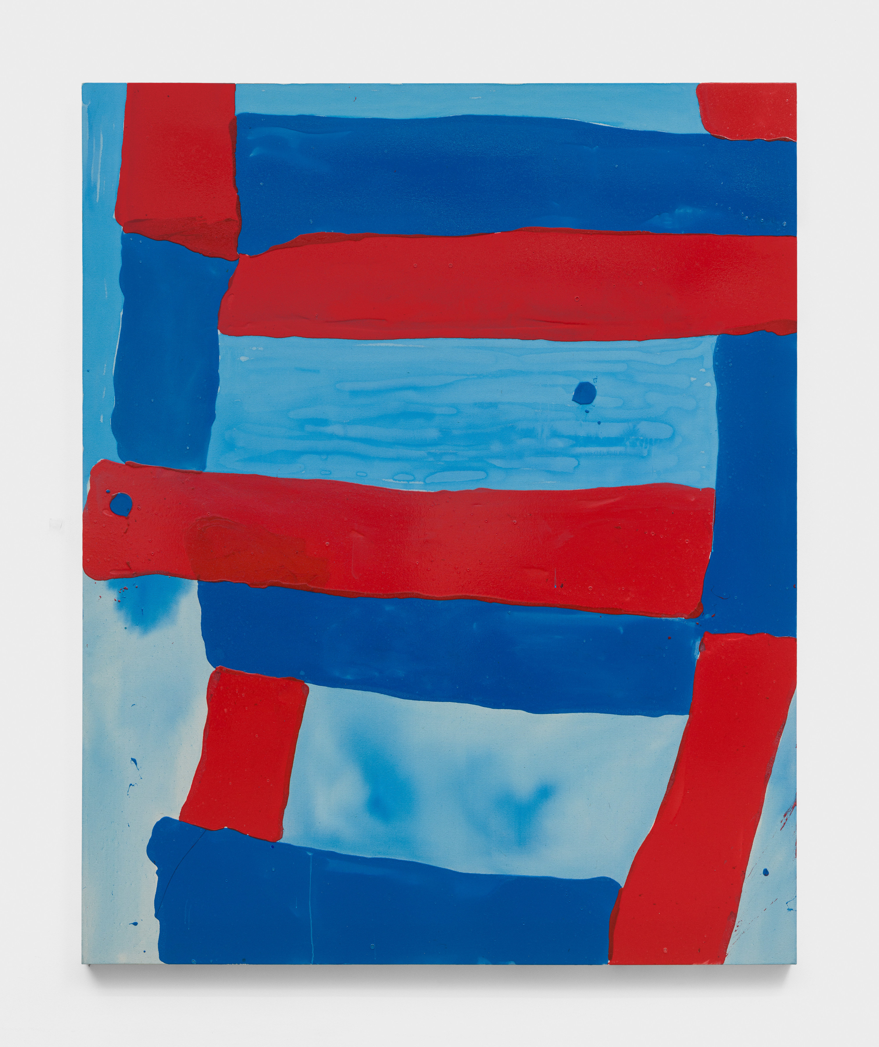 A painting with colorful rectangular swatches of primary red and blue.