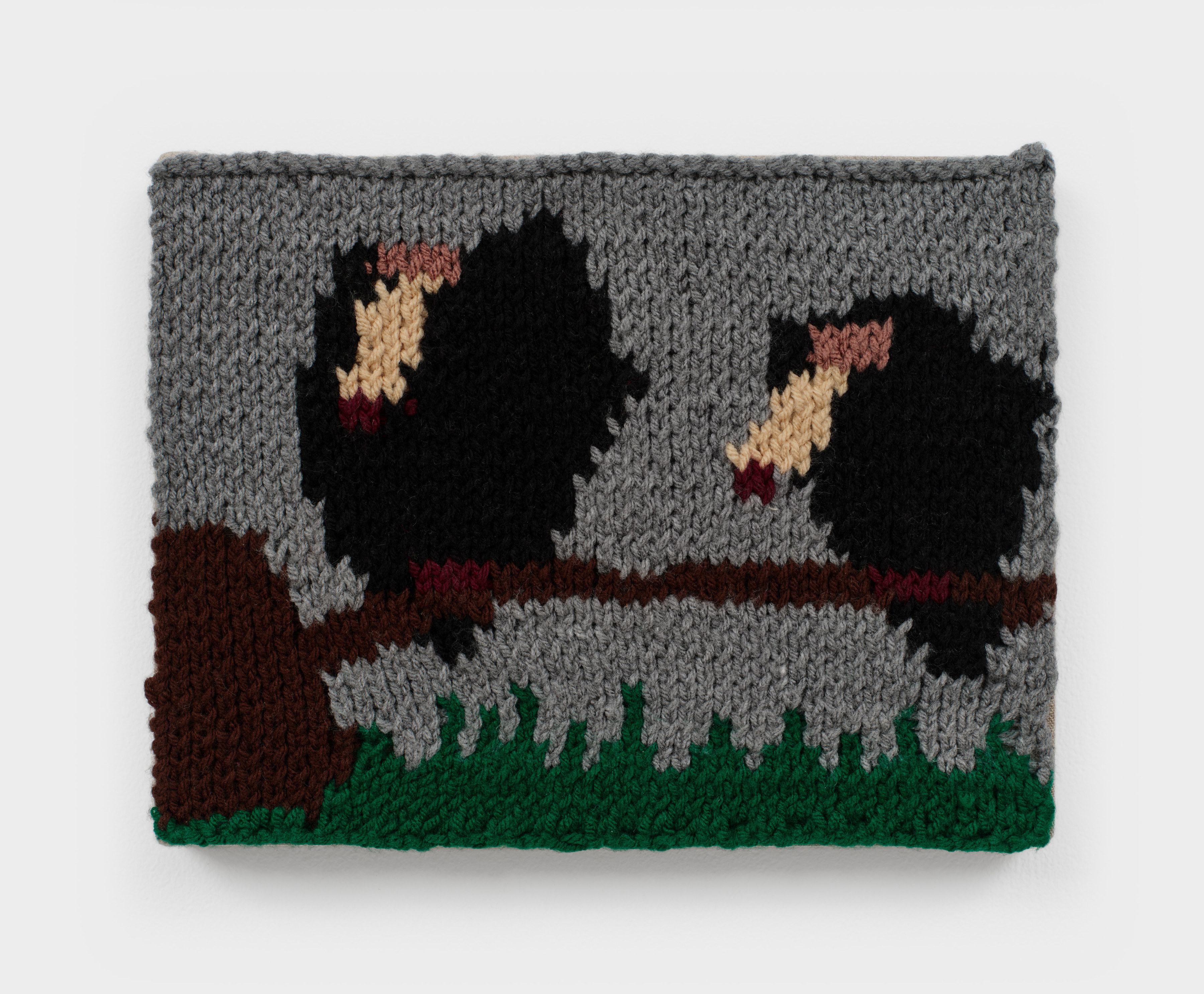 A square knit artwork depicting two vultures on a branch against a grey background sewn onto linen.
