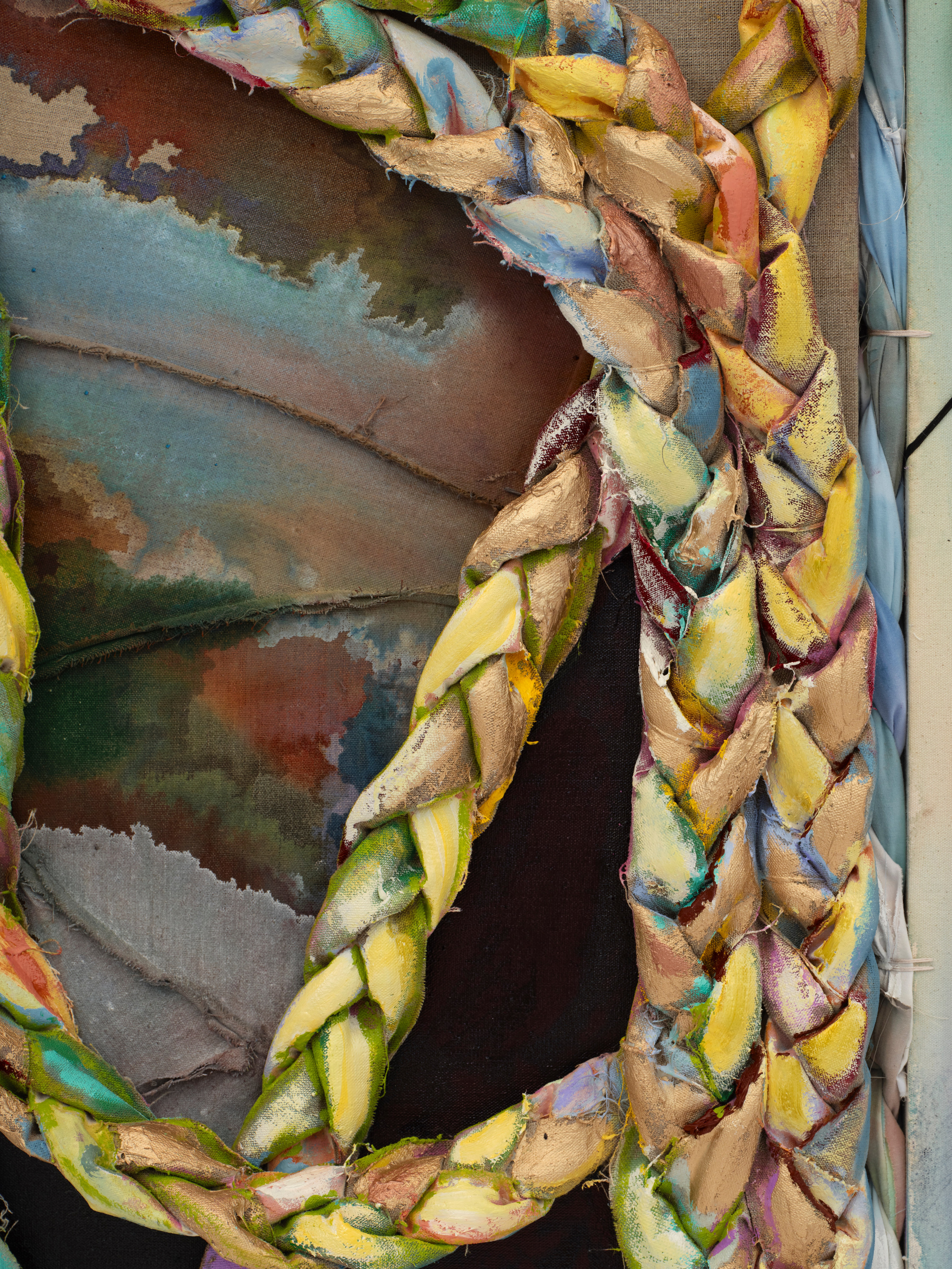 Detail of the work with braided fabric painted orange, blue, yellow and gold overtop of painted canvas in greens, reds and blues. 