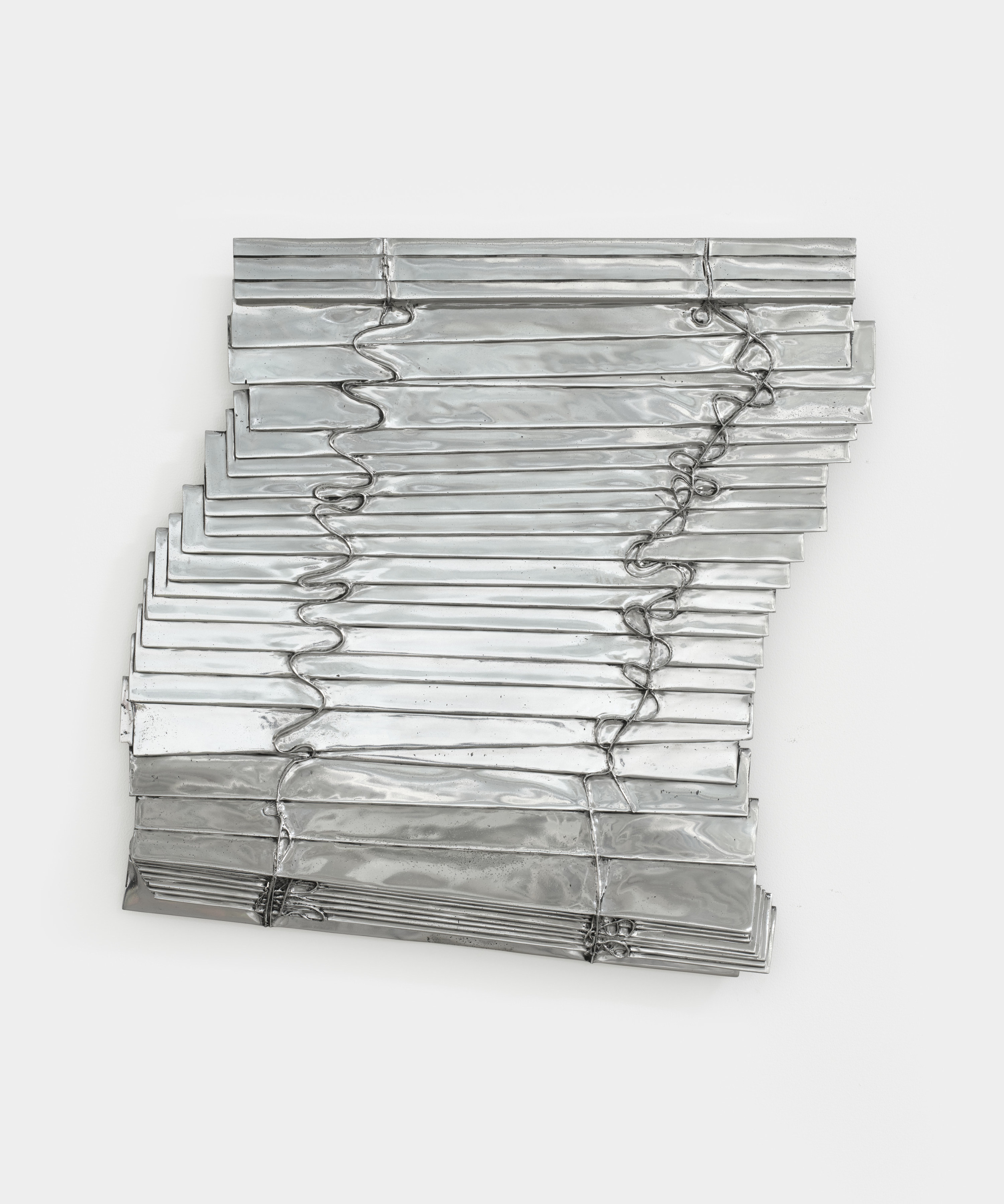 An aluminum sculpture of a window blind.