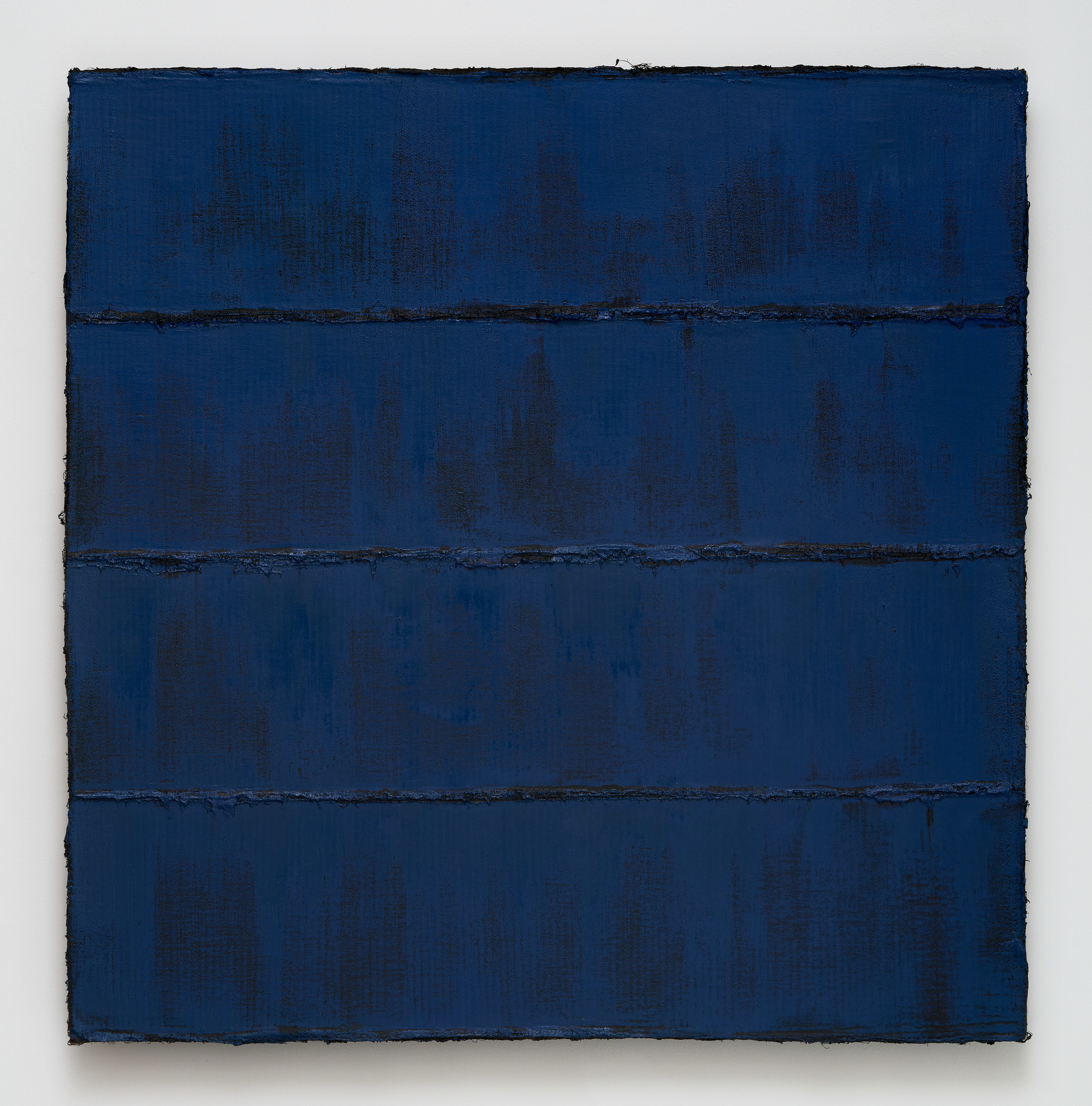 A textured royal blue painting with horizontal lines of pigment. 