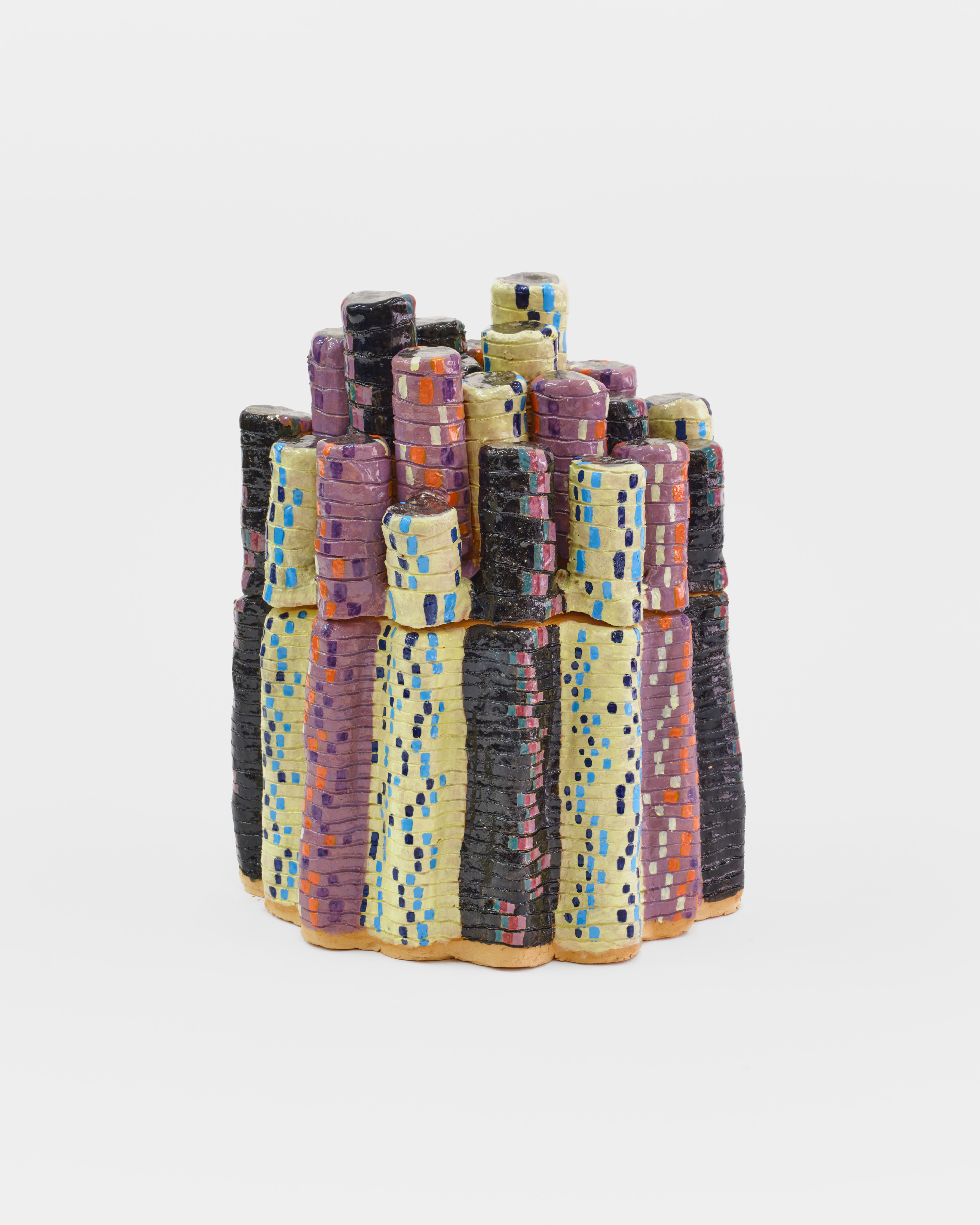 A ceramic sculpture of multicolored towers of poker chips. 