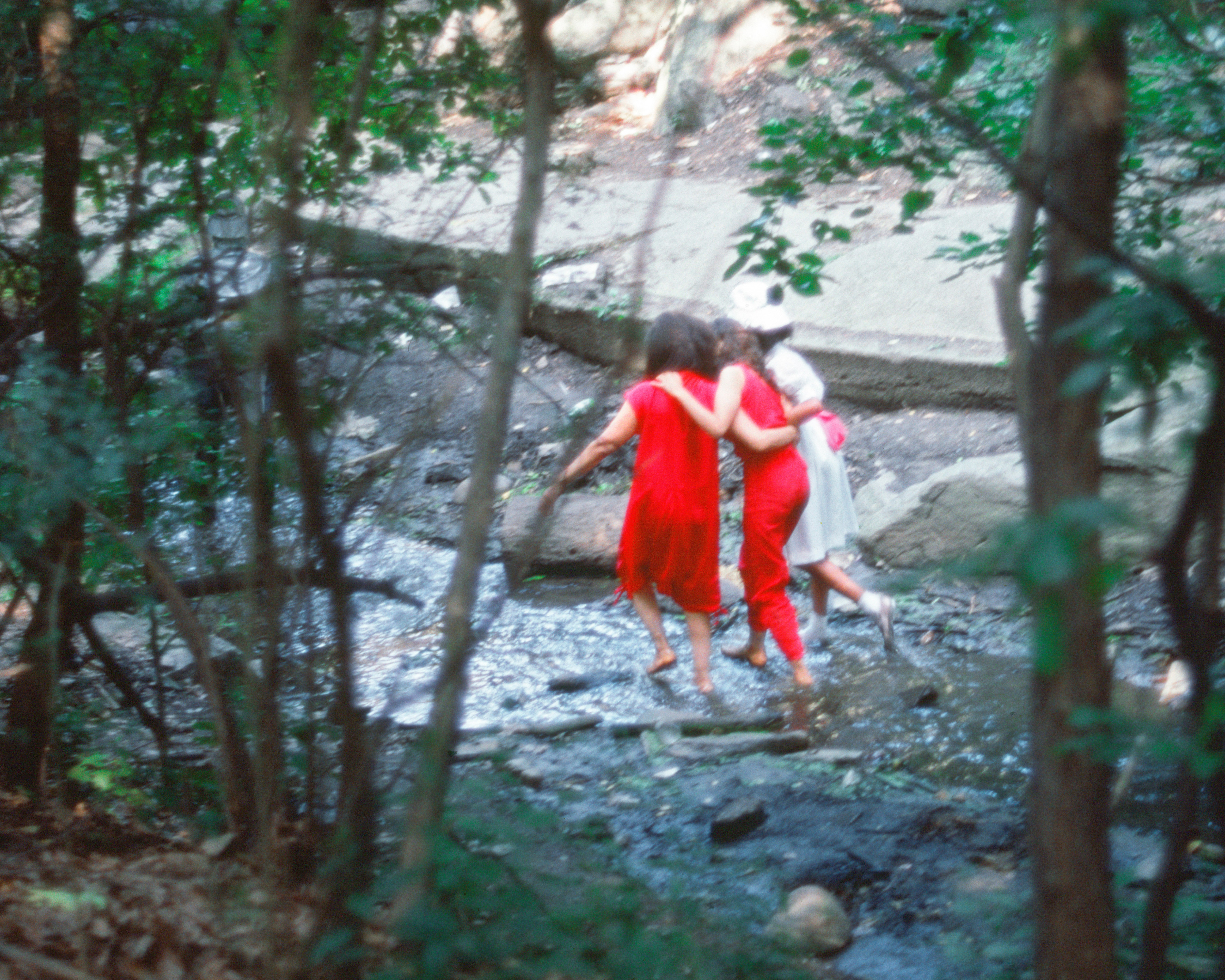 Rivers, First Draft: The Woman in Red, the Teenager in Magenta, and the Little Girl in Pink Sash wade the stream, 1982/2015, Digital C-print from Kodachrome 35mm slides in 48 parts, 16h x 20w in (40.64h x 50.80w cm)