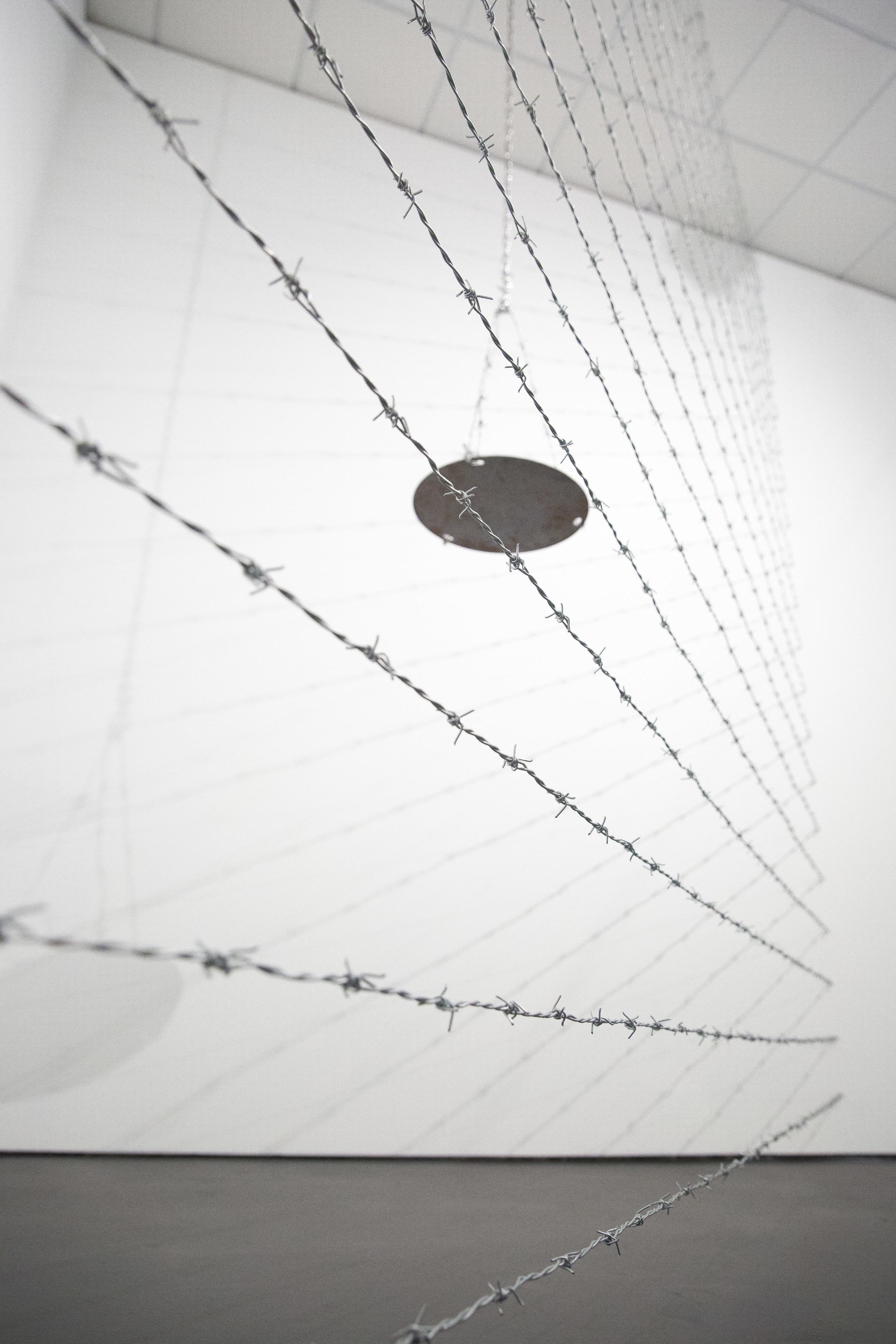 Scales of Injustice, detail, 2017/, barbed wire, chain, and steel, dimensions variable