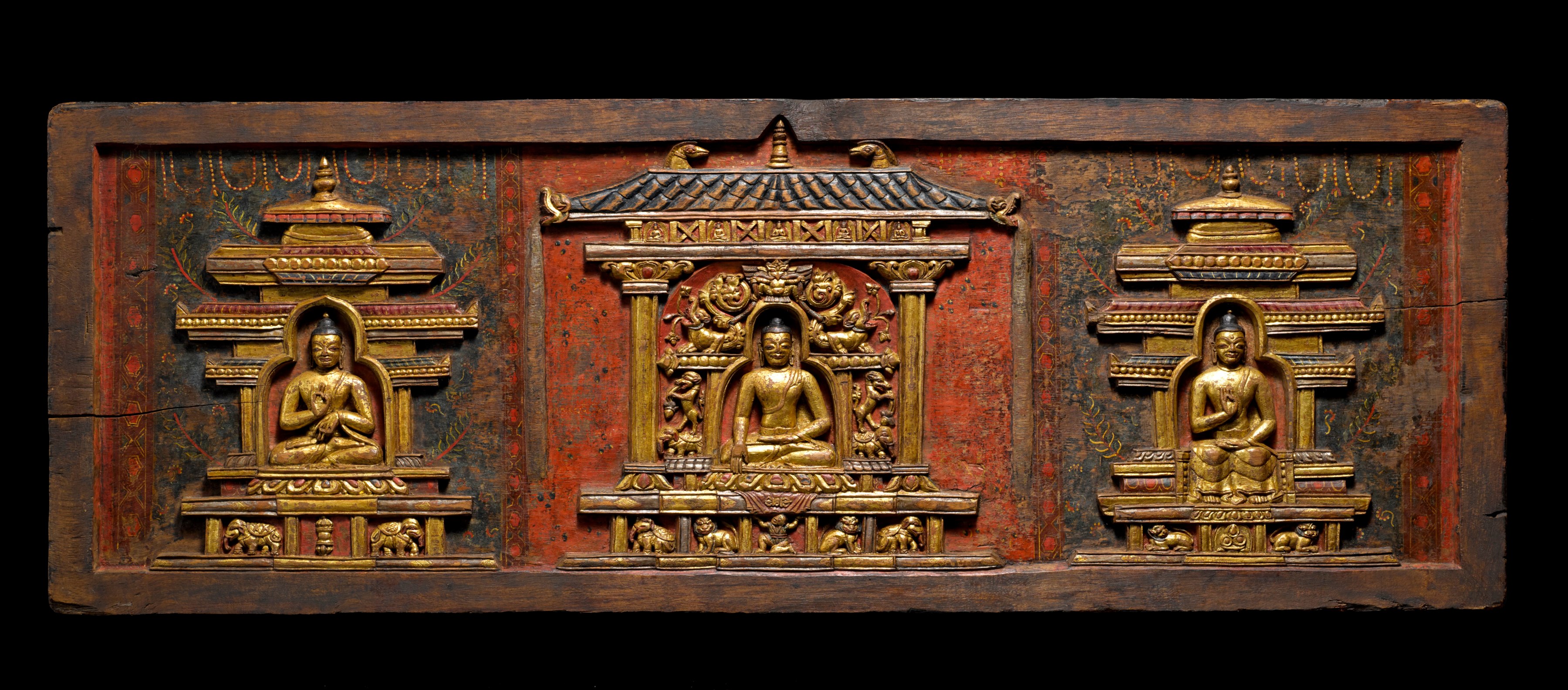 This elegant book cover depicts three Buddhas, from left to right, Vairocana, Sakyamuni, and Amoghasiddhi, seated in a stately manner within their celestial palaces.