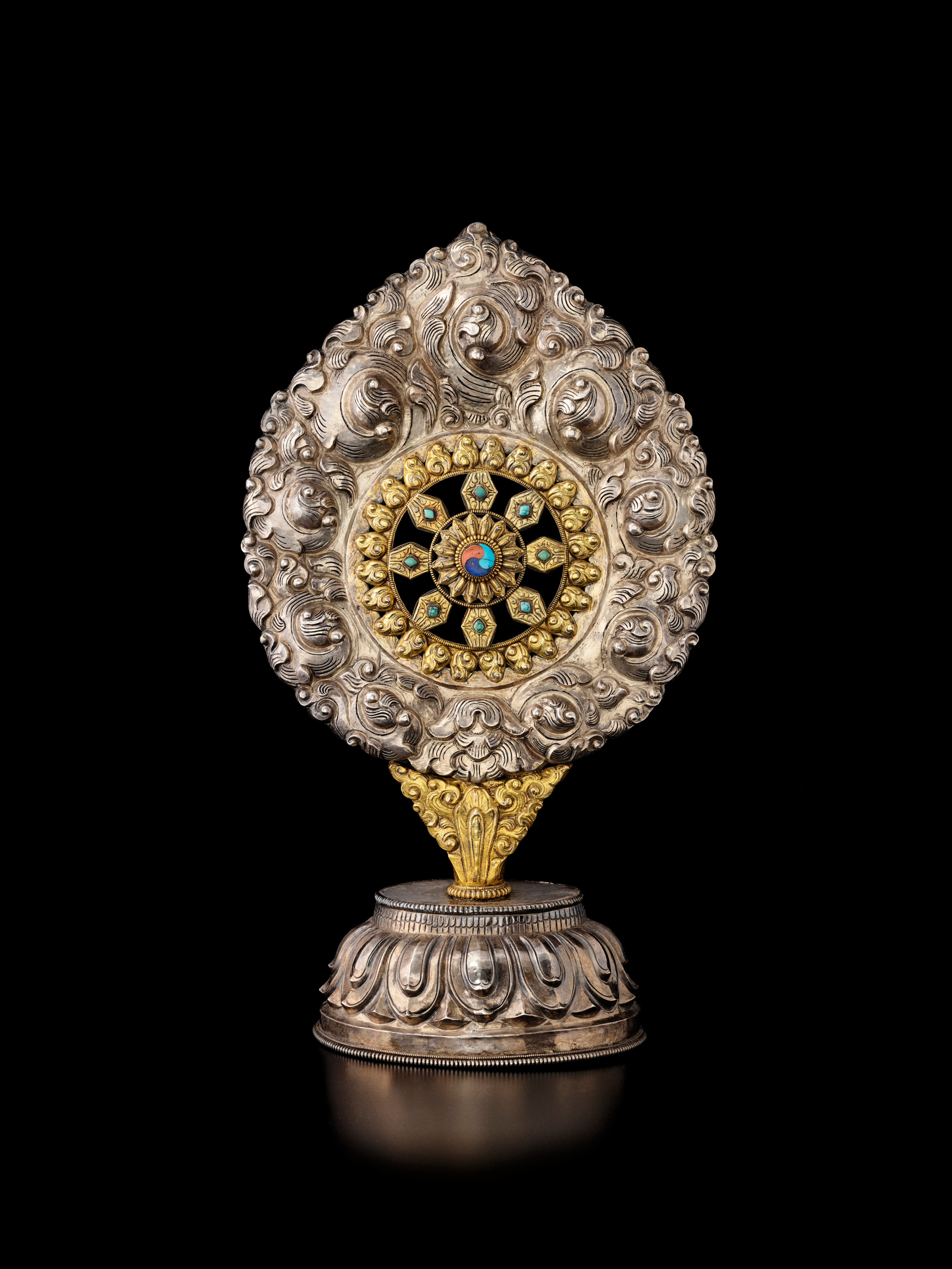 This rare Tibetan ritual object represents the ever-turning Wheel of the Buddhist Law.