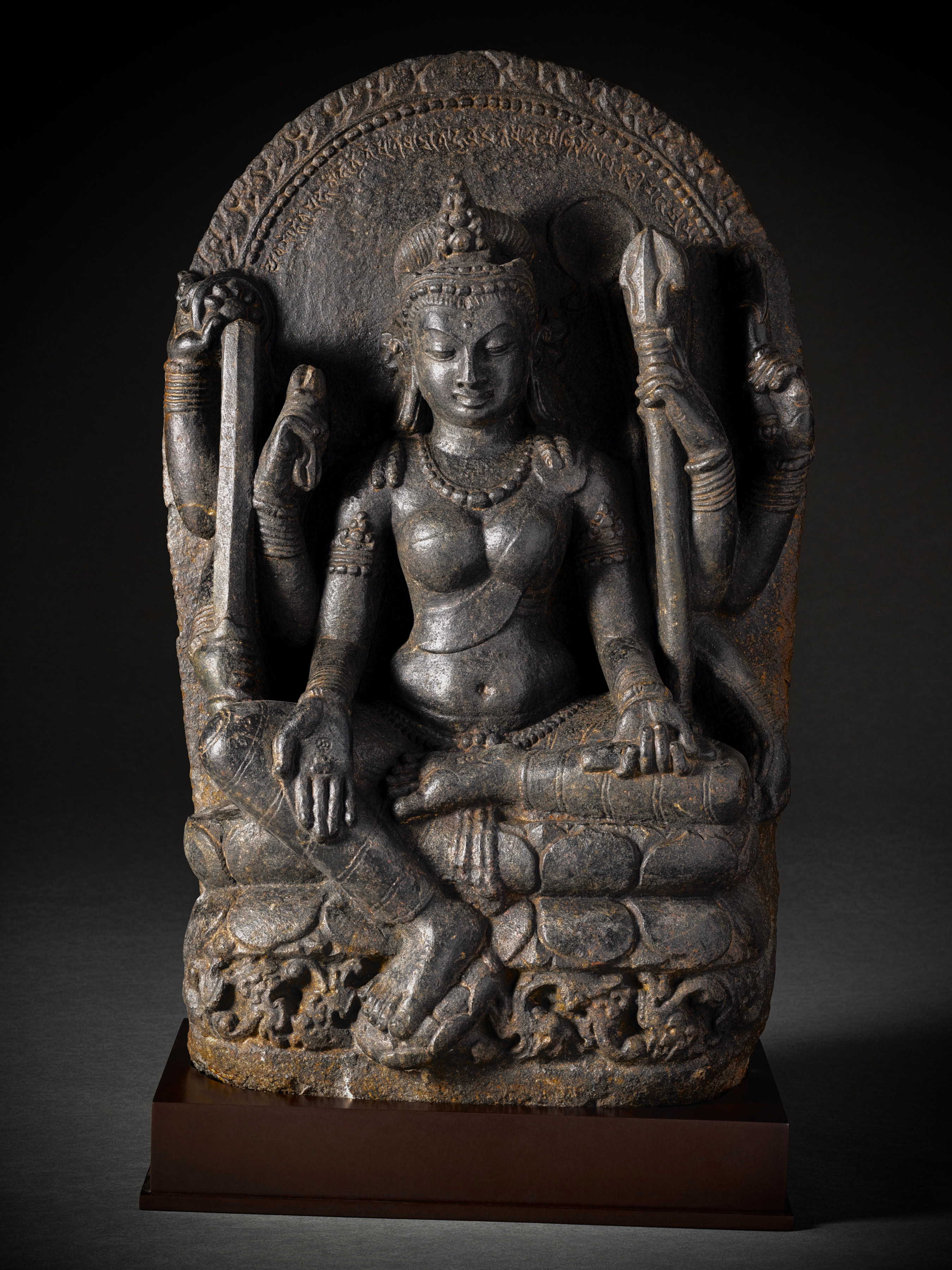 Larger photo of This remarkable sculpture portrays Mahapratisara, the principal Raksha goddess, with her distinctive eight arms adorned with various symbolic attributes.