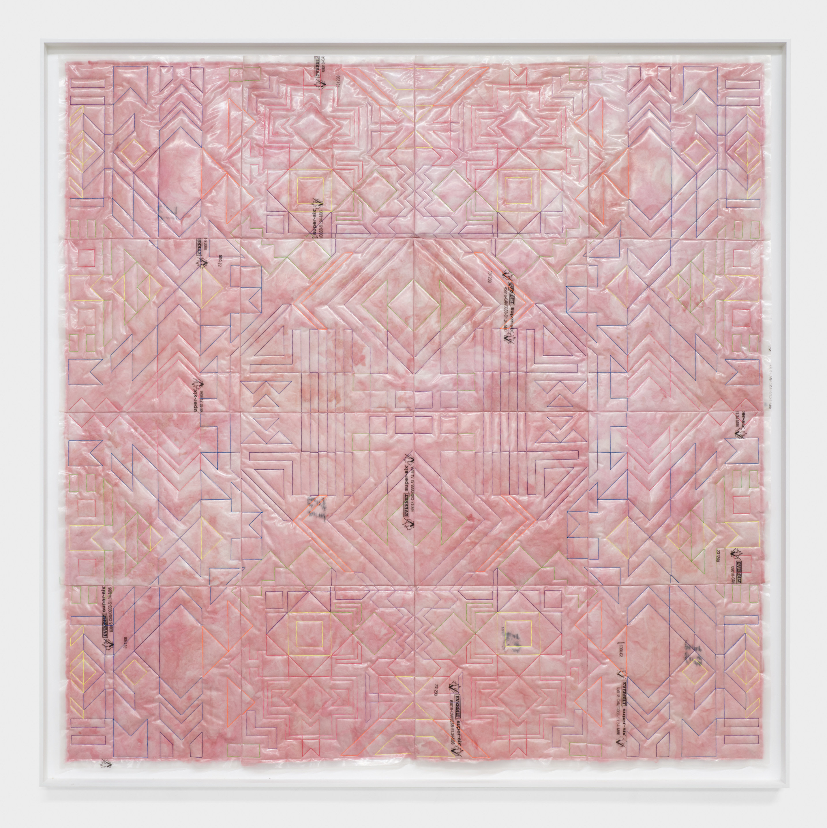 A square framed artwork with patterns sewn into pink insulation material.